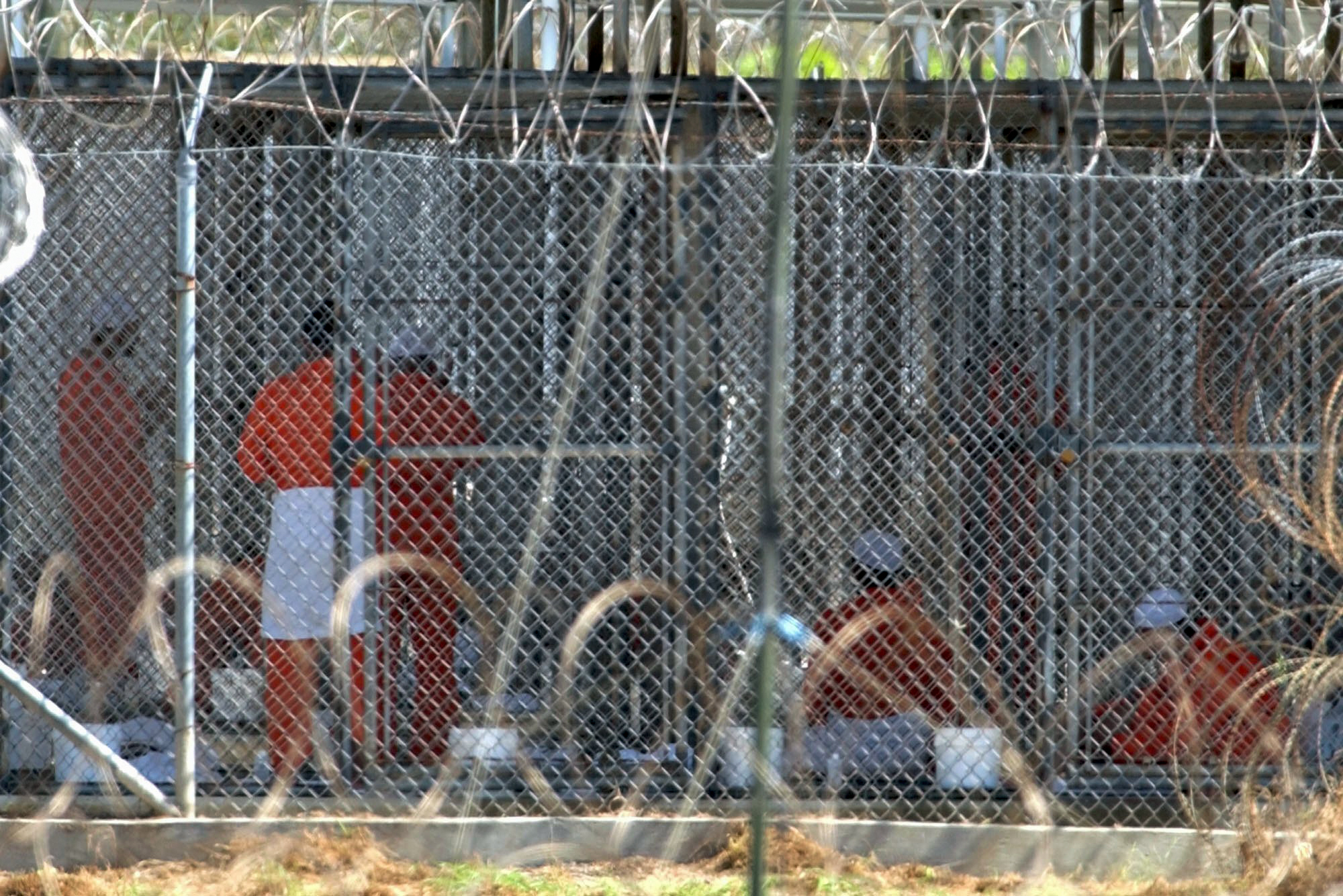 Detainees in orange jumpsuits at Guantanamo Bay