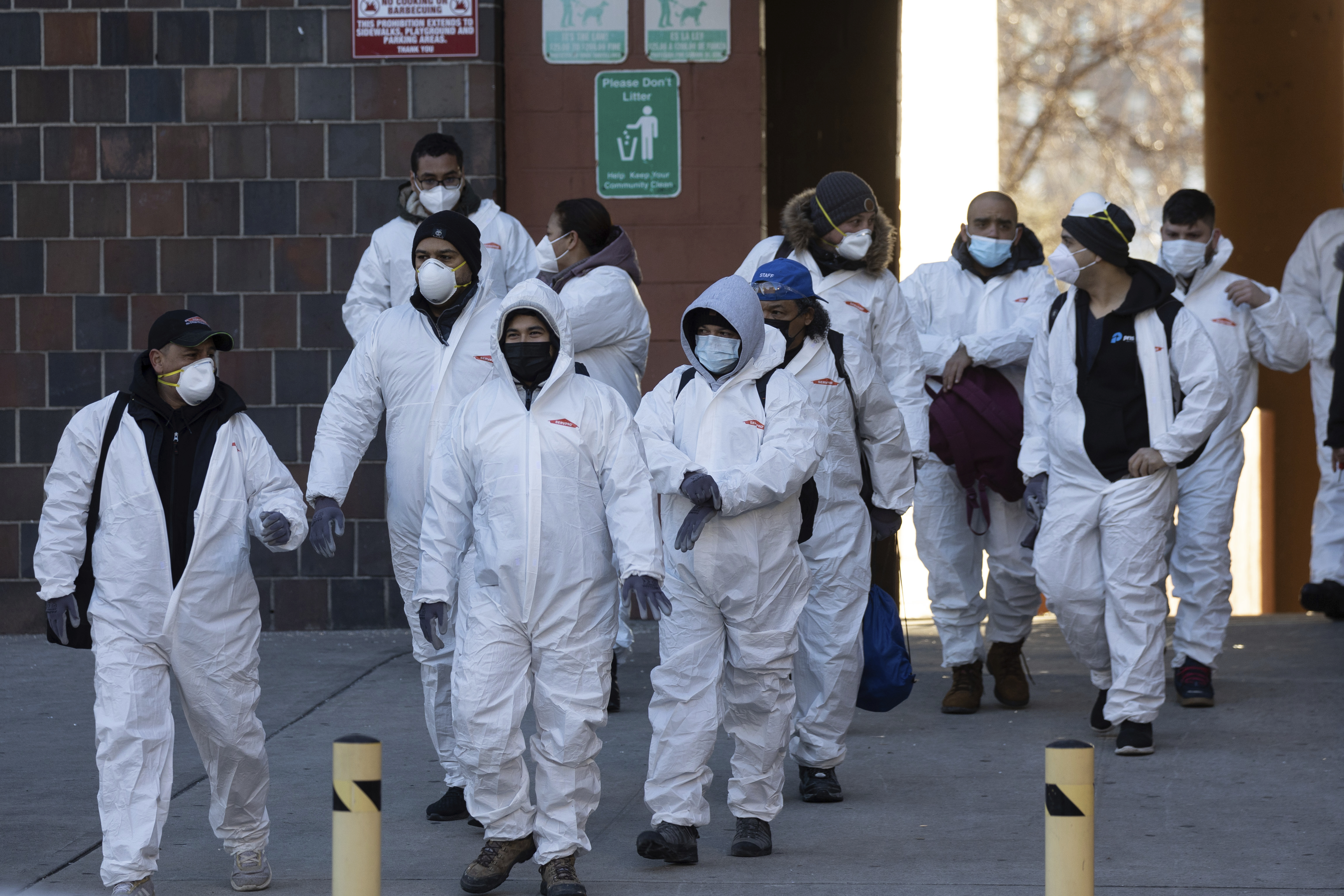 Cleaning and recovery crews working outside Bronx building