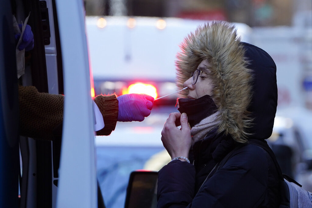 A woman gets tested for COVID-19