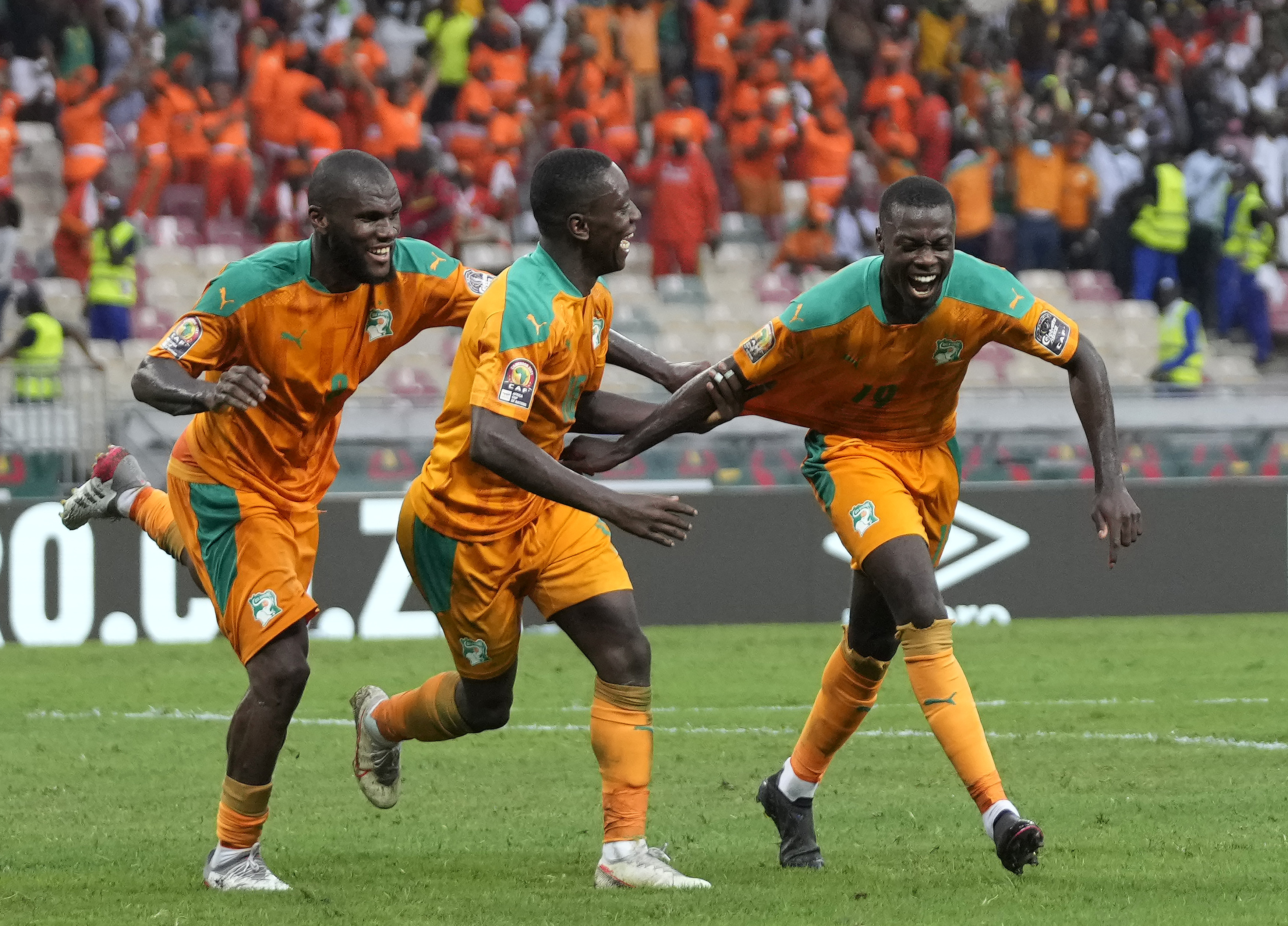 Ivory Coast's Nicolas Pepe, right, celebrates with teammates after scoring during the African Cup of Nations 2022 group E soccer match between Ivory Coast and Algeria