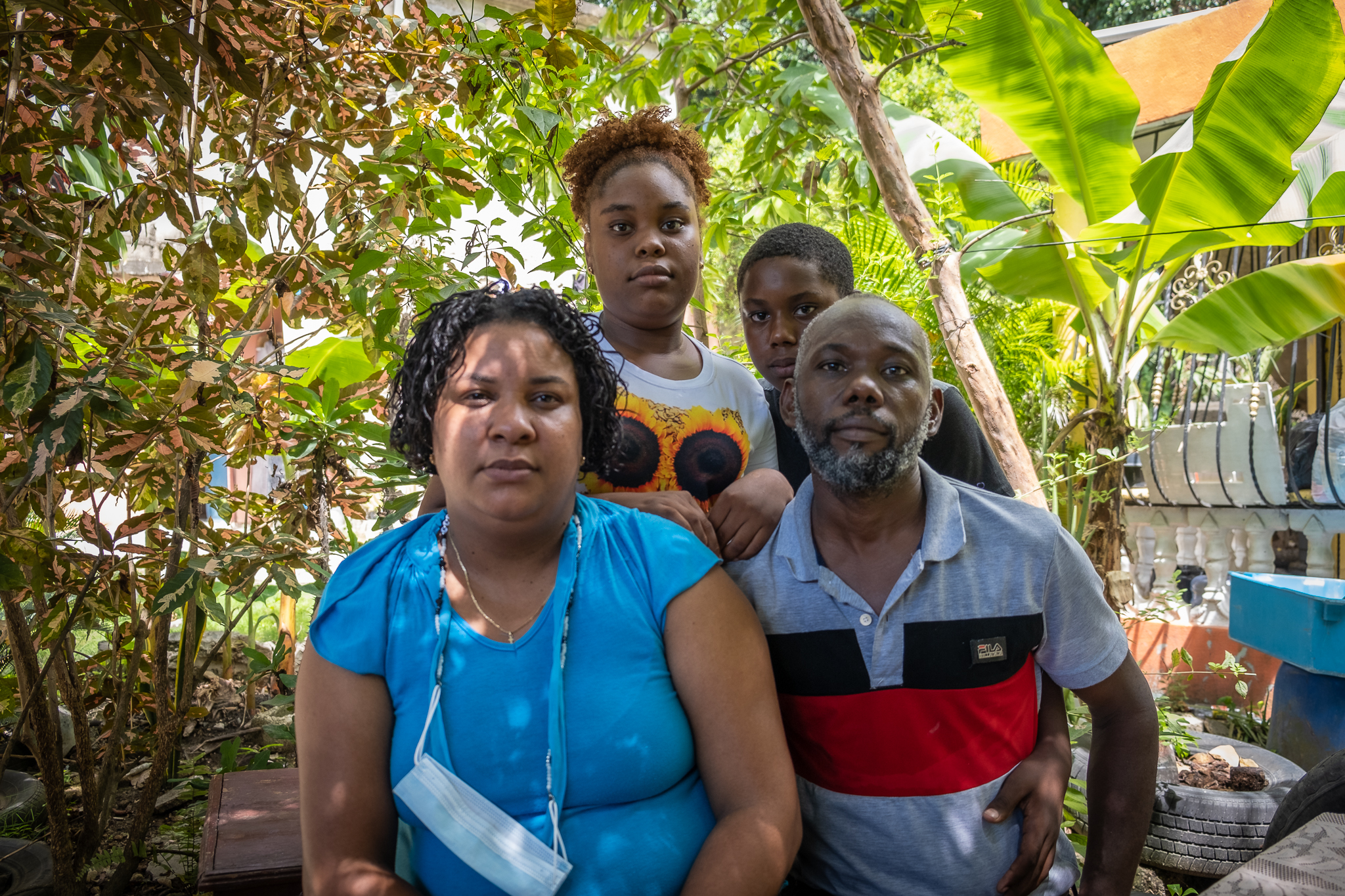 Mariano German De La Cruz, a Dominican man, with his wife and two children