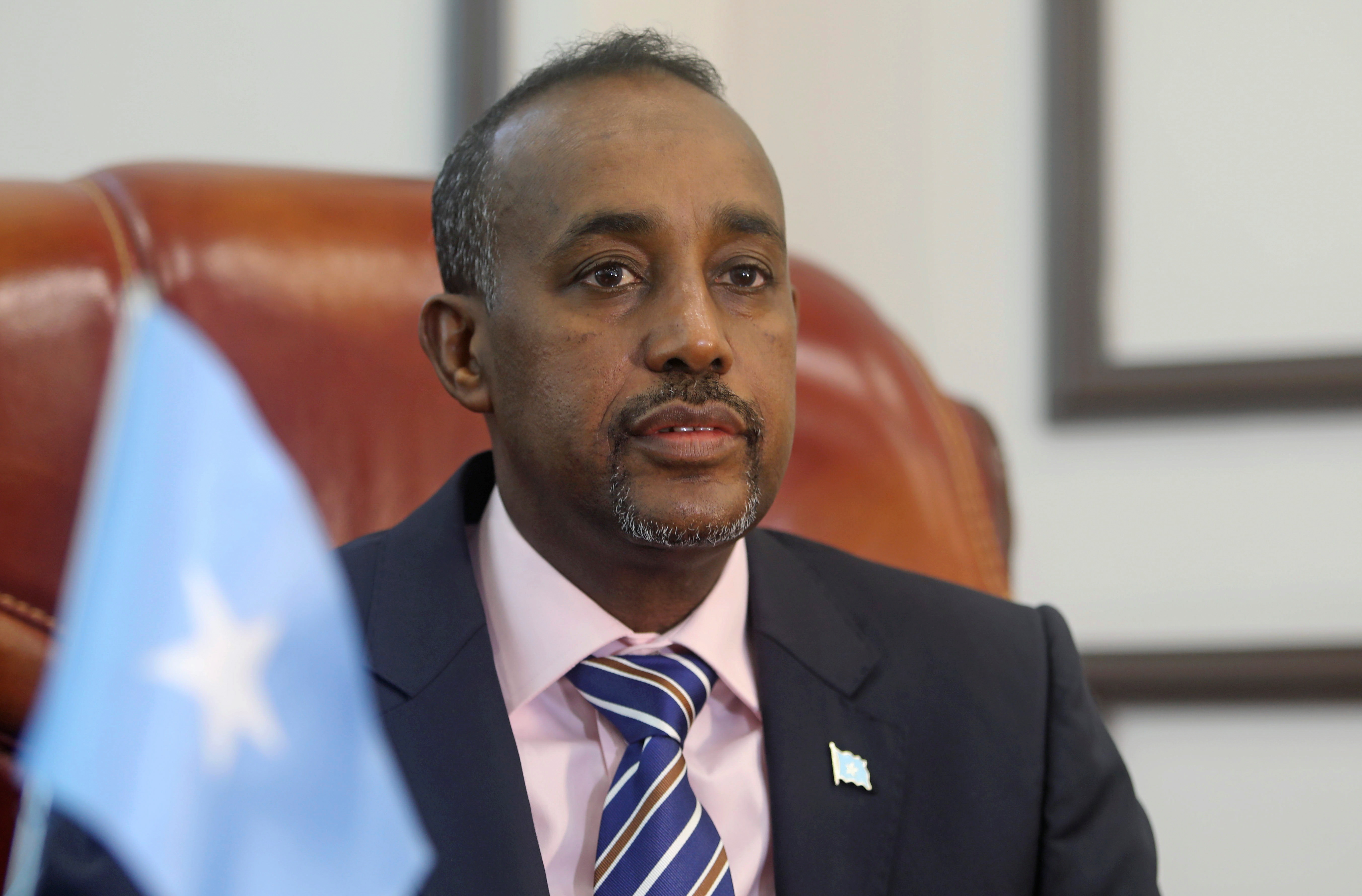 Somalia's Prime Minister Mohamed Hussein Roble looks on before addressing members of parliament in Mogadishu.