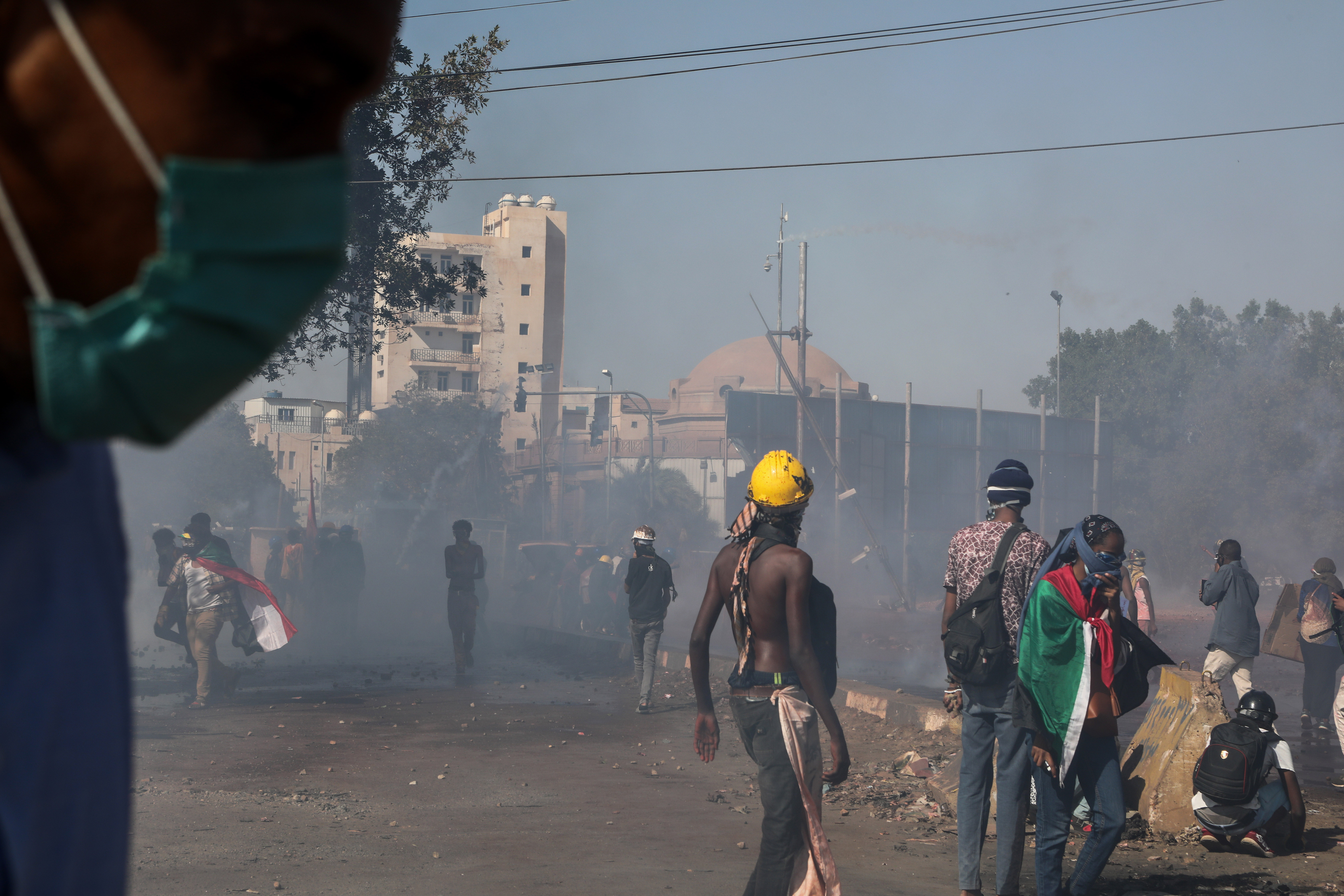 Sudanese protesters clash with security forces during a protest against military coup, in Khartoum, Sudan, 30 January 2022.