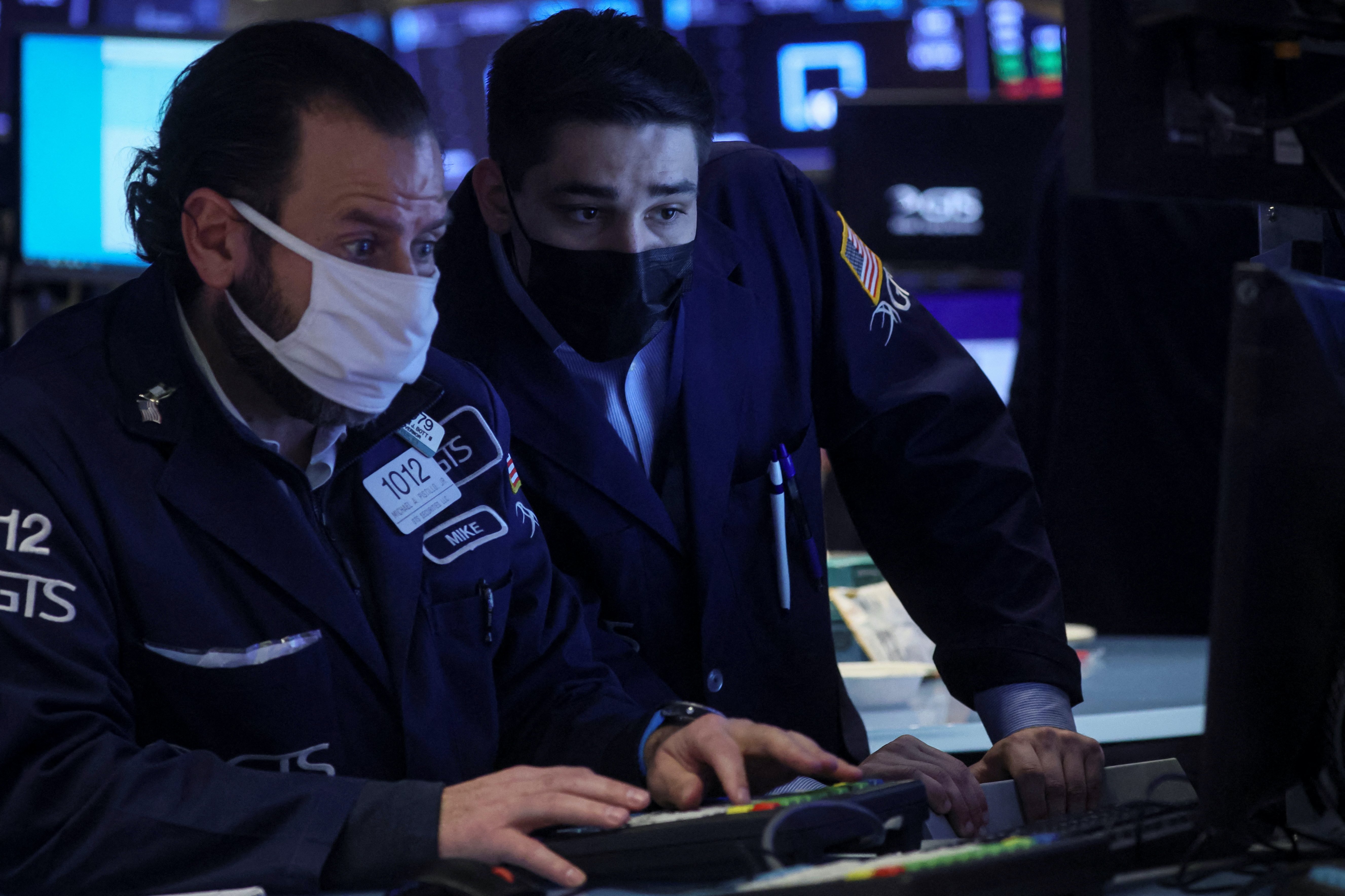 Traders work on the floor of the New York Stock Exchange (NYSE)