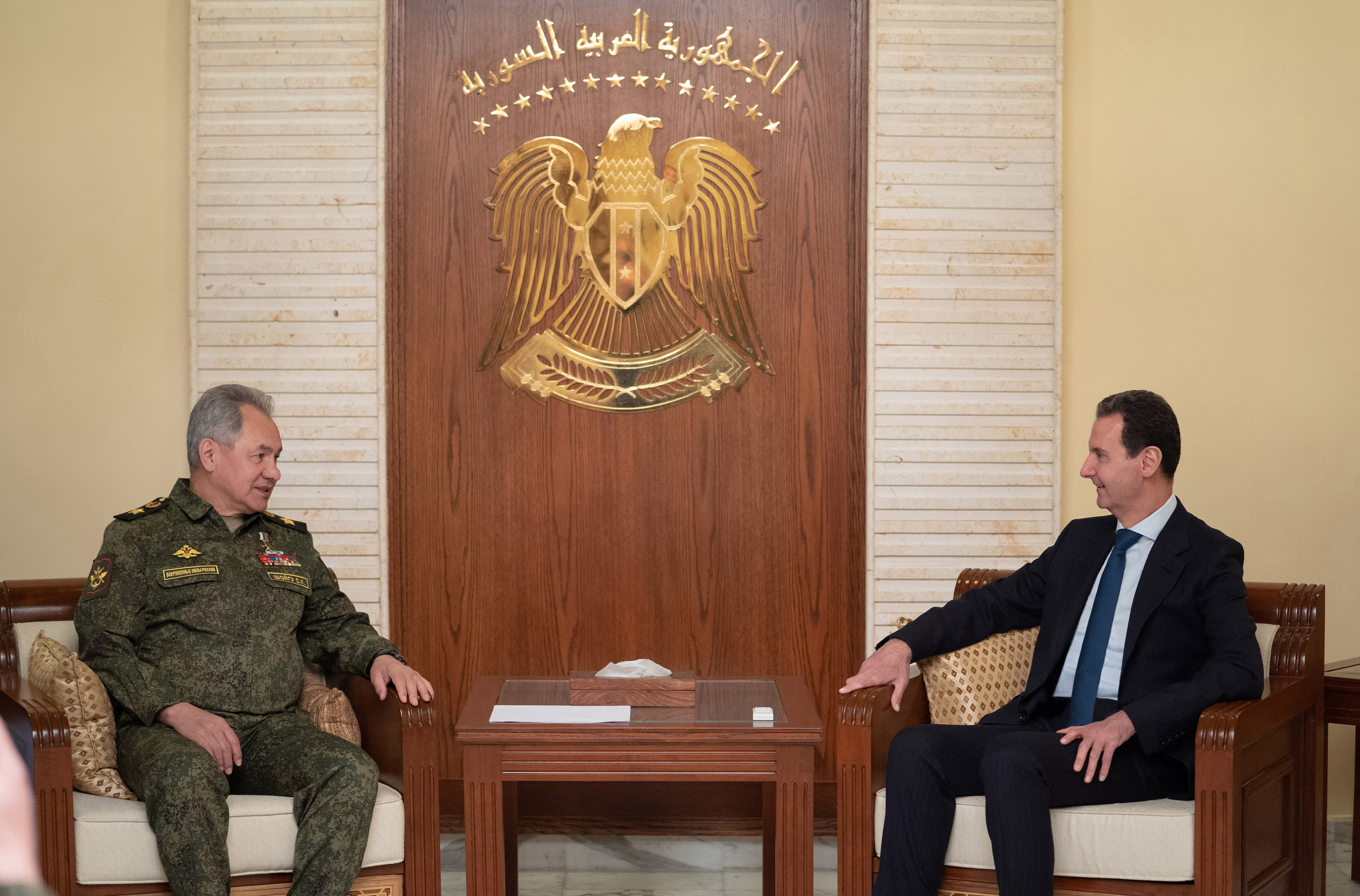 Syria's President Bashar al-Assad (R) receiving Russia's visiting Defence Minister Sergei Shoigu