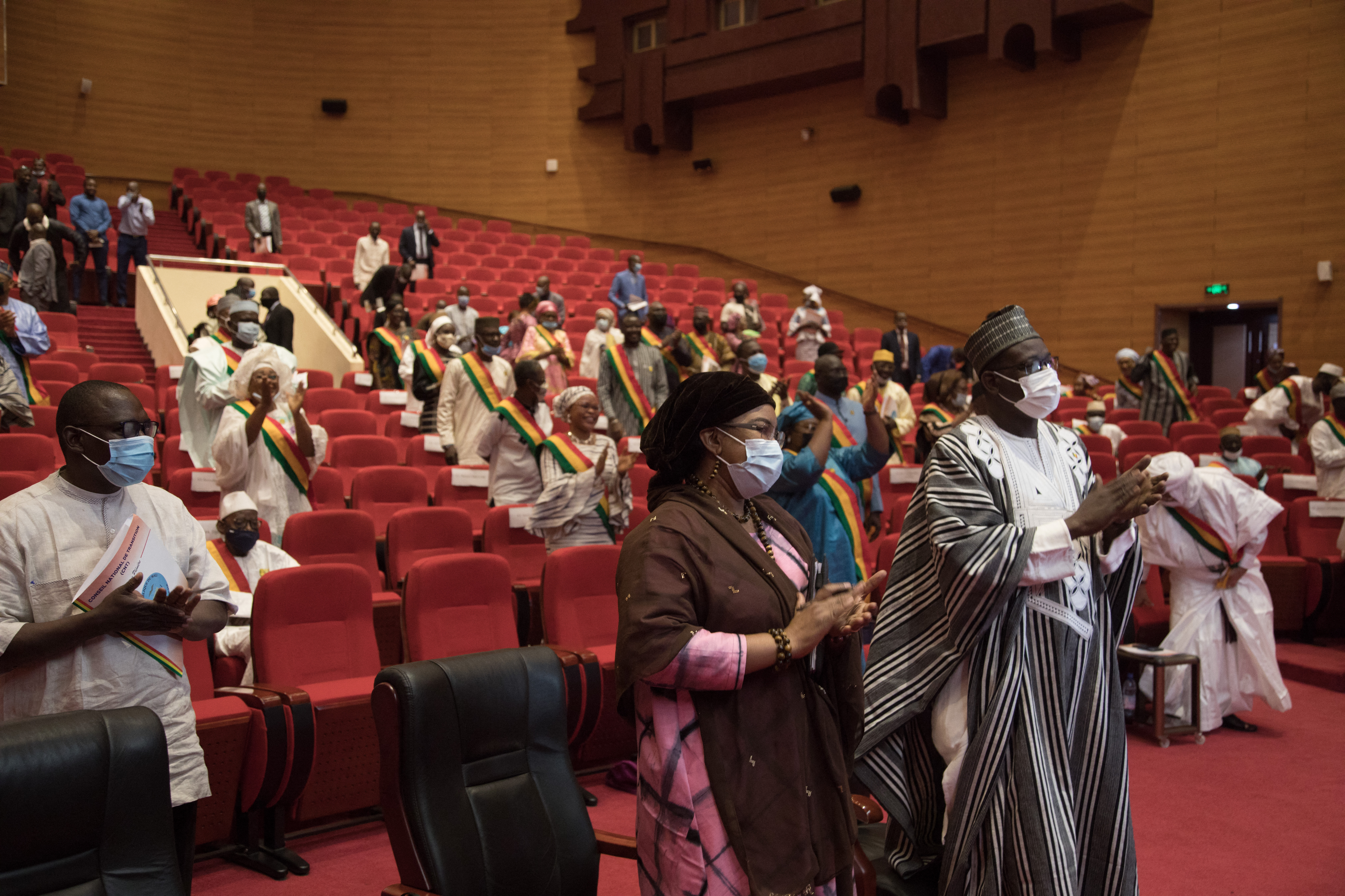 Members of the National Transitional Council (NTC) give a standing ovation to the military president and junta representative, Malick Diaw in Bamako