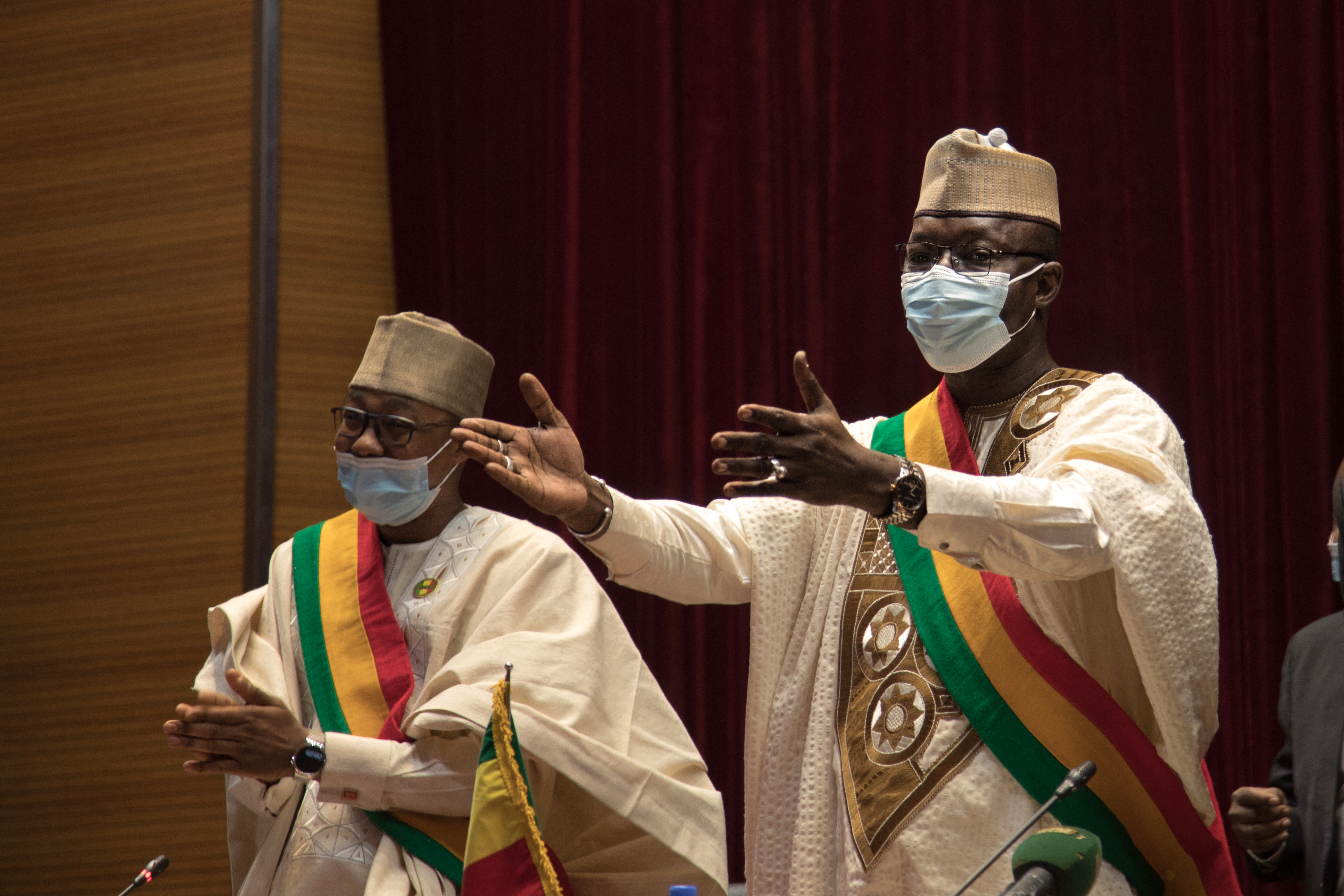 President of the National Transitional Council (NTC), Malick Diaw (R) addresses members of the council during a meeting to vote on a revised charter in Bamako