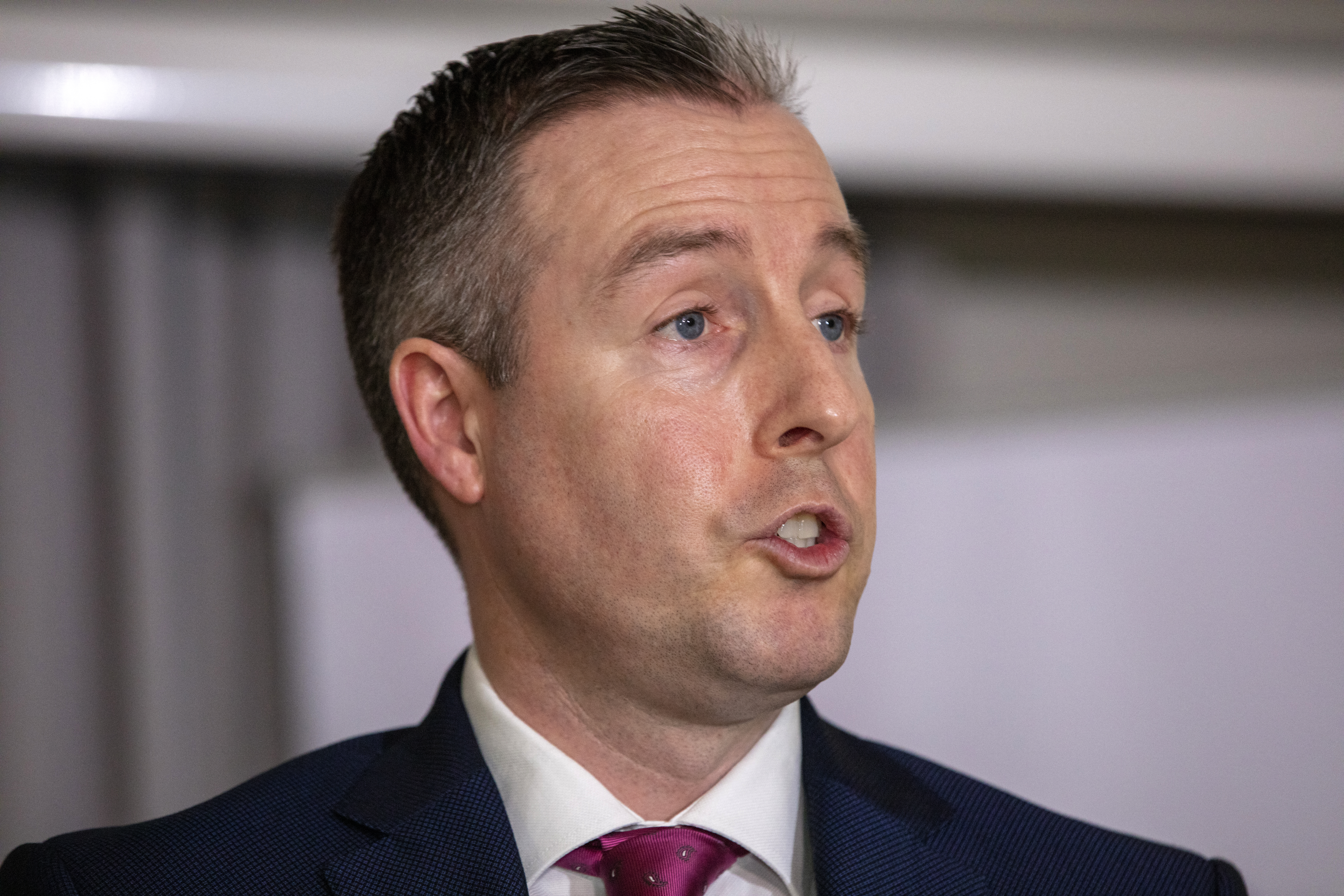 Northern Ireland's unionist First Minister Paul Givan makes a statement at the Crowne Plaza hotel in south Belfast