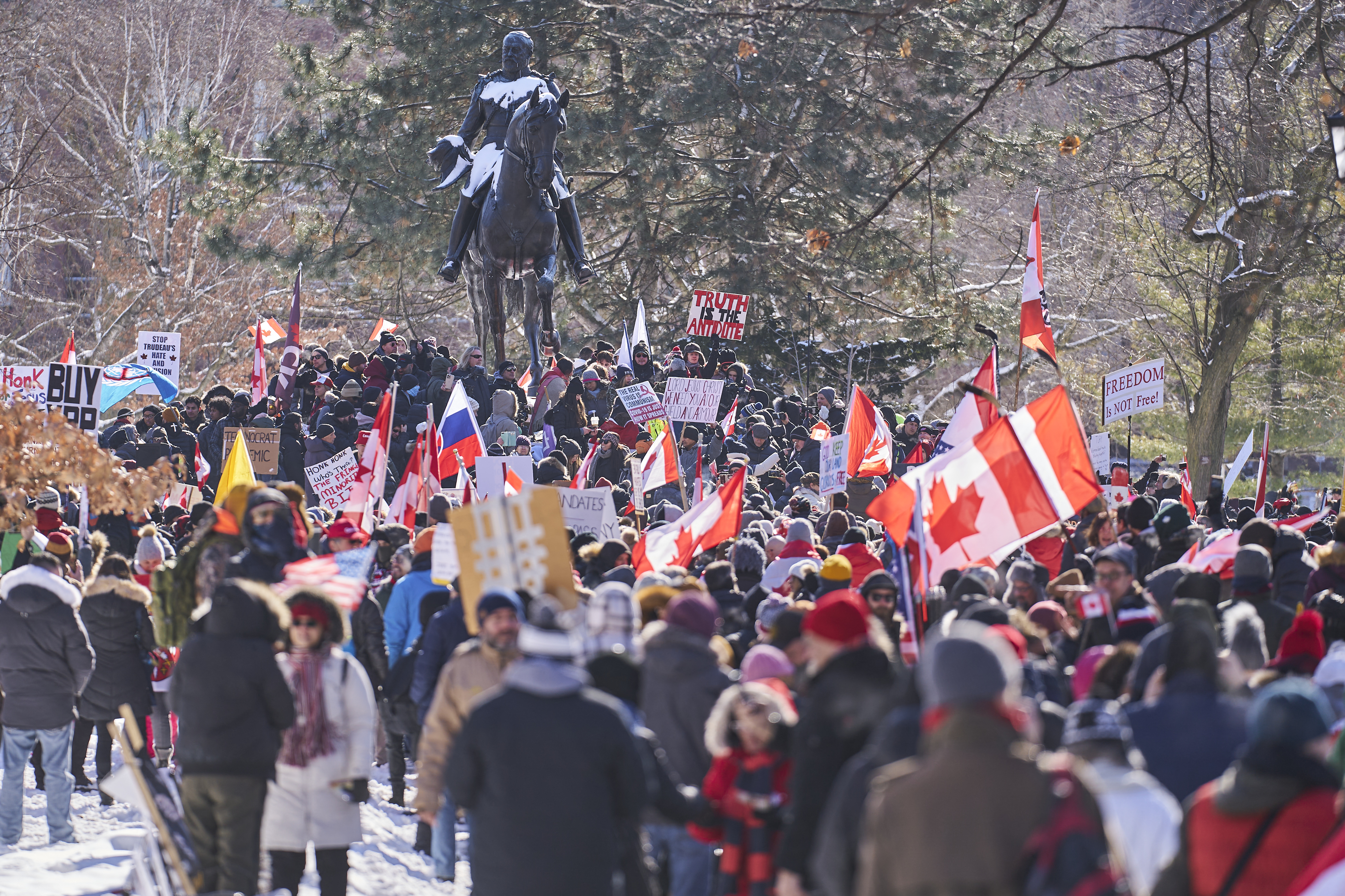 Demonstrators gather for a protest against mandates related to Covid-19 vaccines and restrictions in downtown Toronto, Ontario, Canada, on February 5, 2022. -