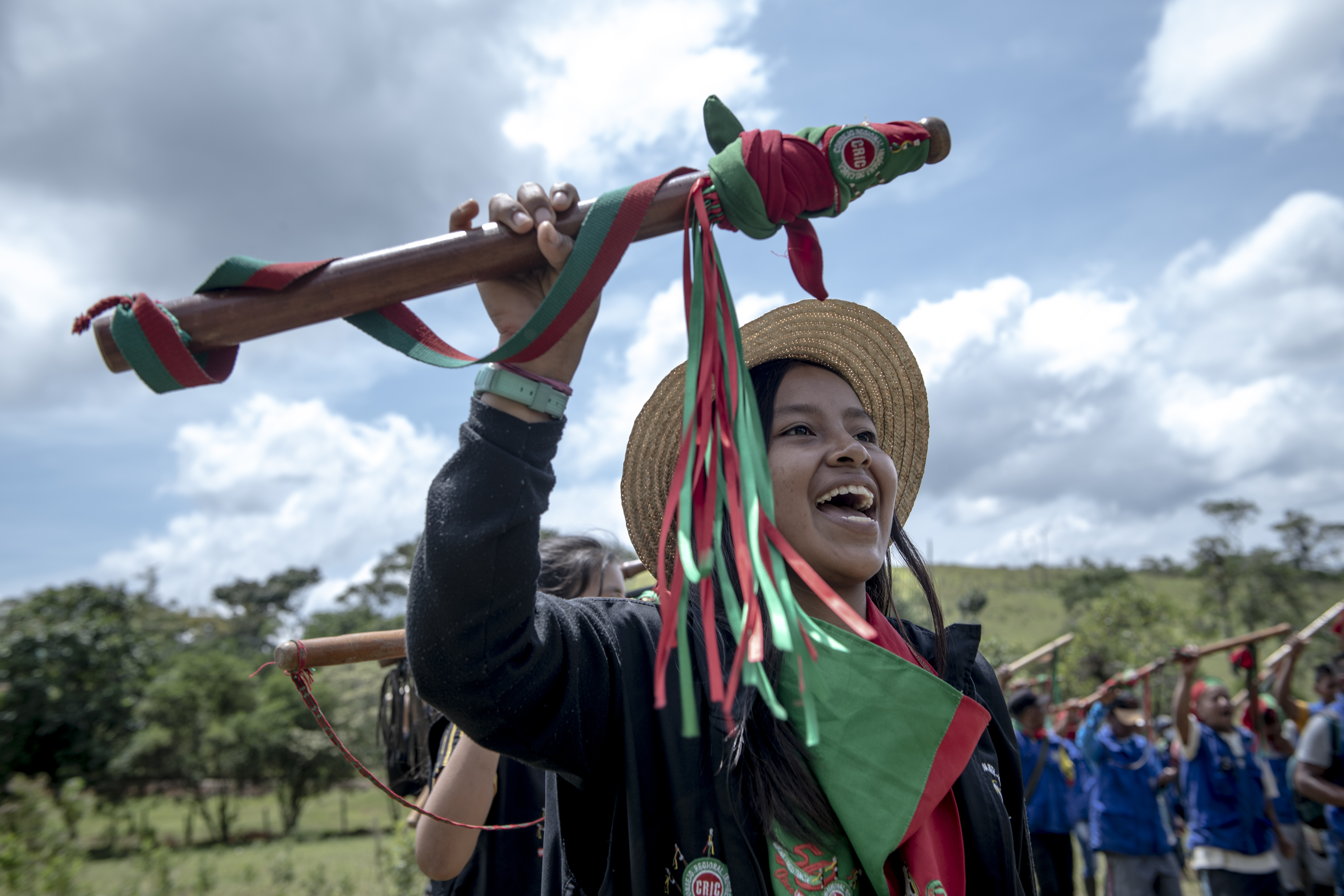 At a meeting of the Indigenous Guard during CRIC's 50th anniversary commemoration, a young girl holds up the baton that identifies her as an Indigenous Guard.