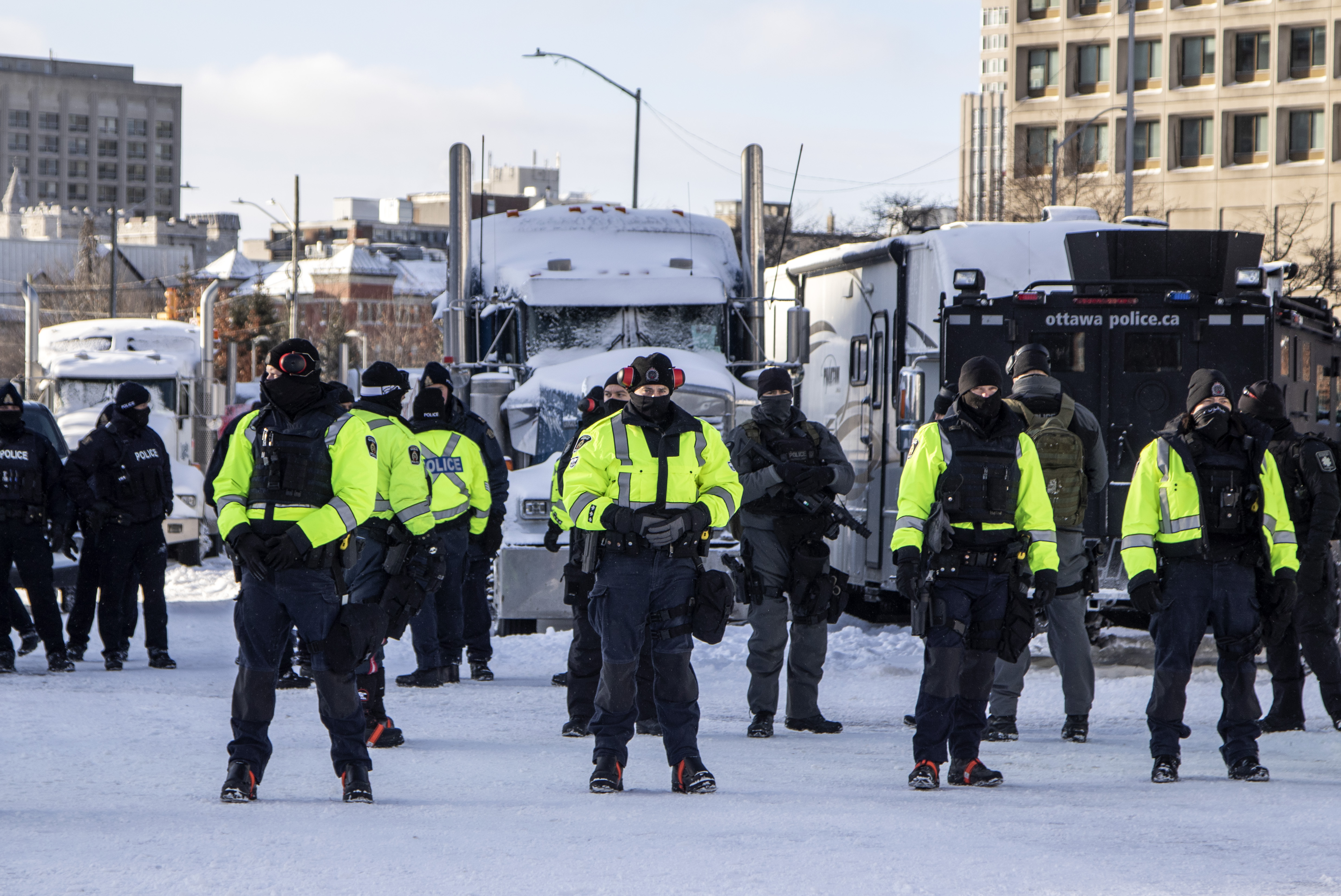 A line of Canadian police prepare to make arrests in Ottawa