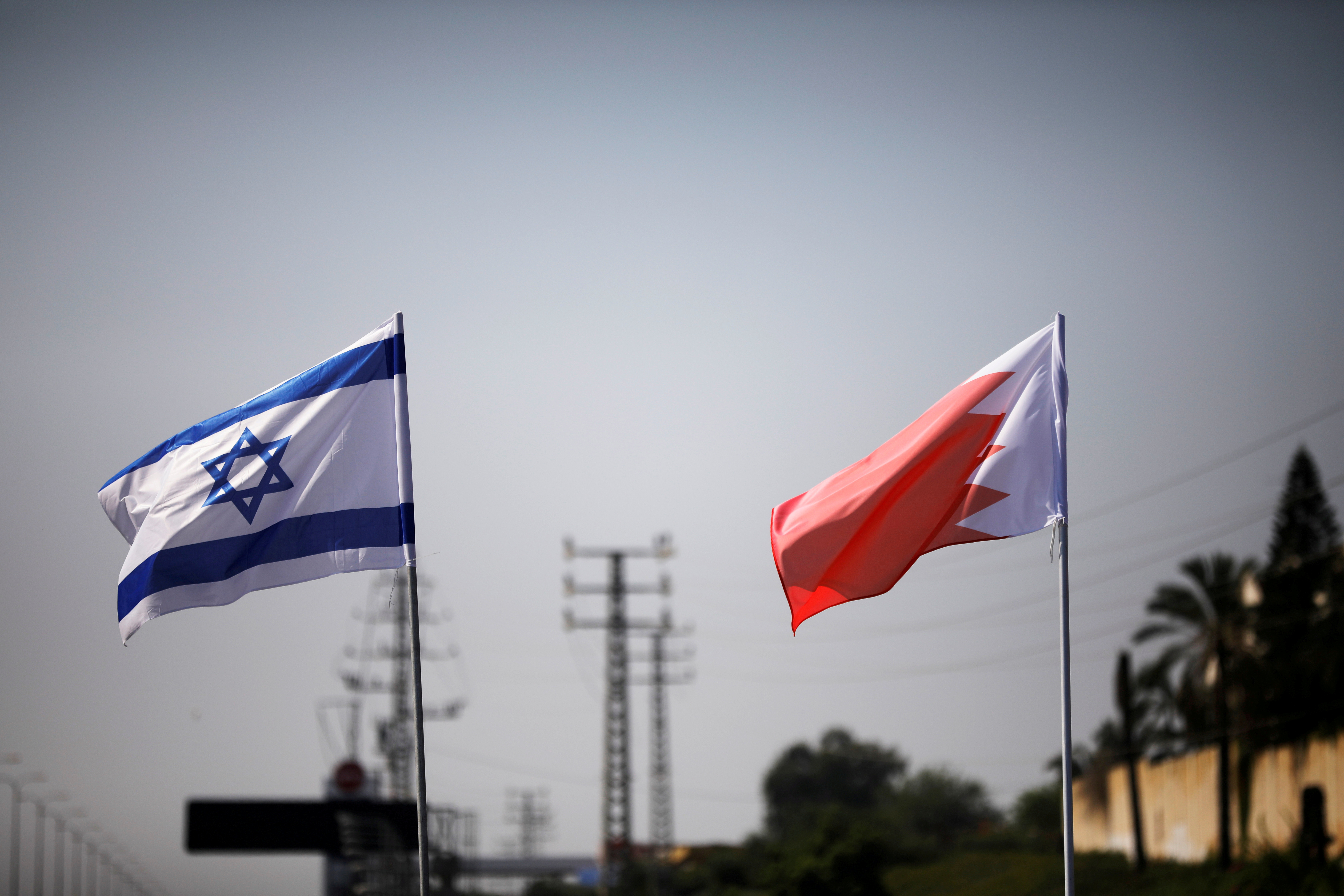 The flags of Israel and Bahrain flutter along a road in Netanya, Israel