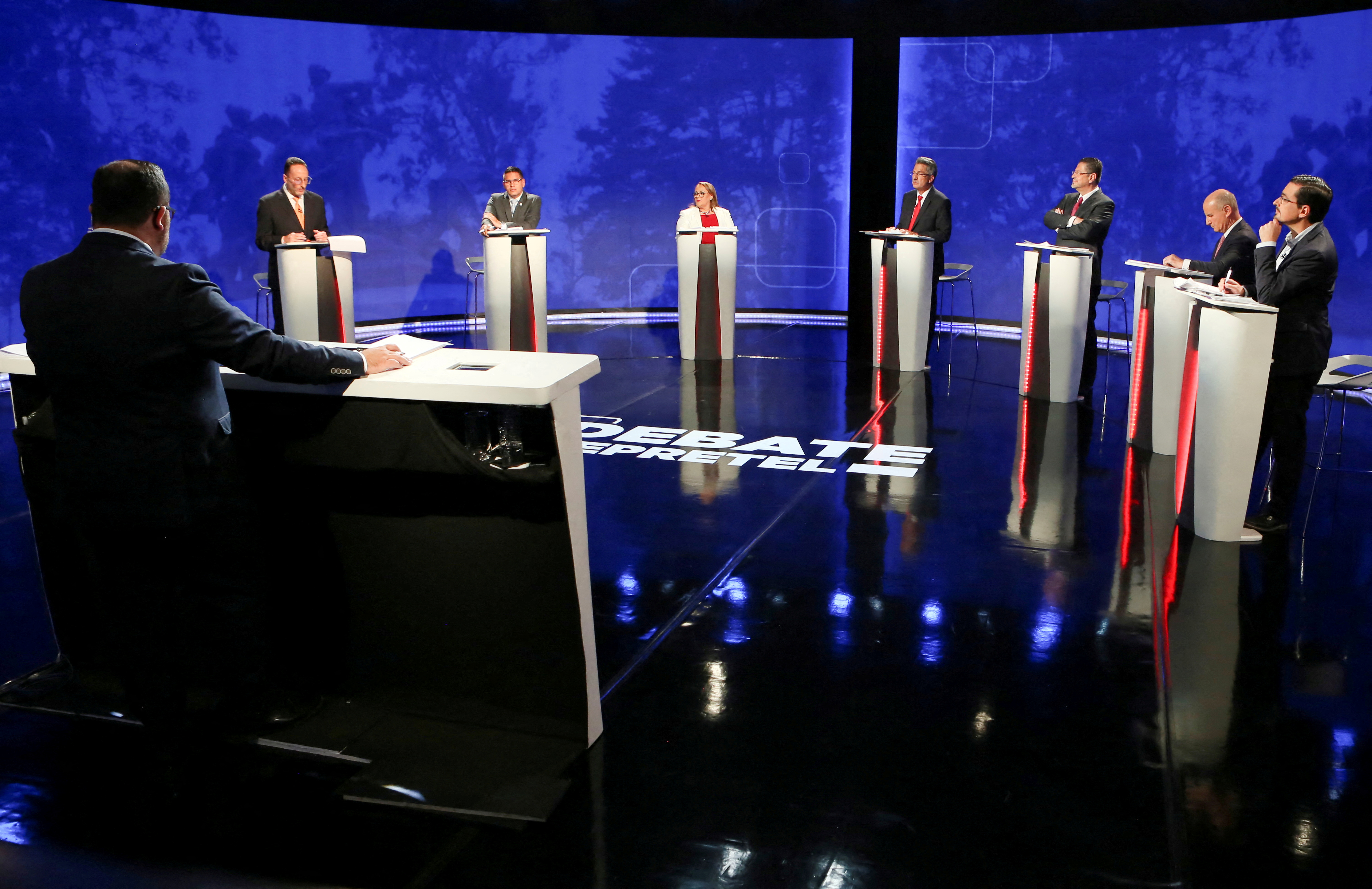 Presidential candidates Eliecer Feinzaig of Progressive Liberal Party (PLP), Fabricio Alvarado of the New Republic Party (PNR), Lineth Saborio of Social Christian Unity Party (PUSC), Welmer Ramos of Citizen Action Party (PAC), Rodrigo Chaves of the Social Democratic Progress Party (PPSD), Jose Maria Figueres of the National Liberation Party (PLN), and Jose Maria Villalta of the Broad Front (FA) take part in a television debate ahead of the general election, in Heredia, Costa Rica