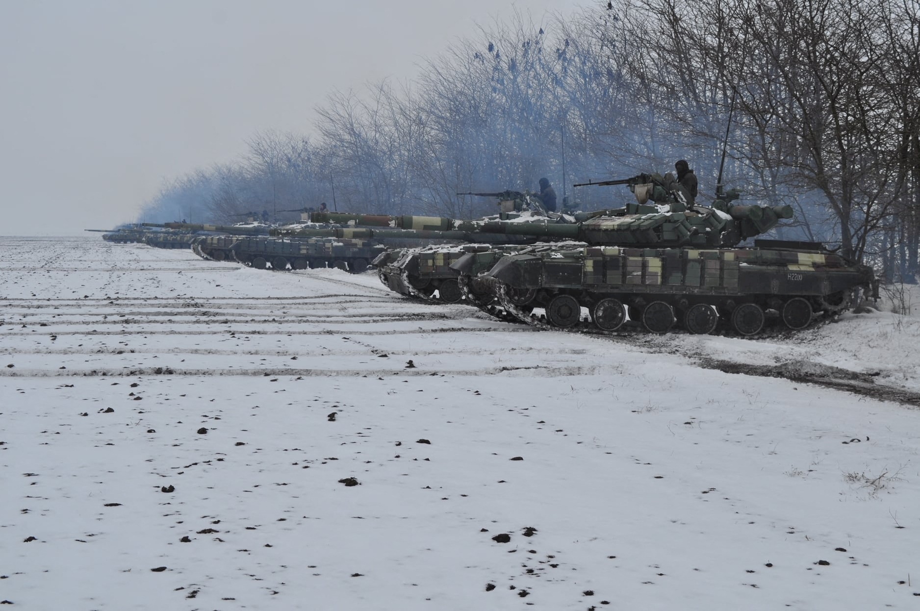 Service members of the Ukrainian Armed Forces are seen atop of tanks during military drills at a training ground in the Dnipropetrovsk region, Ukraine