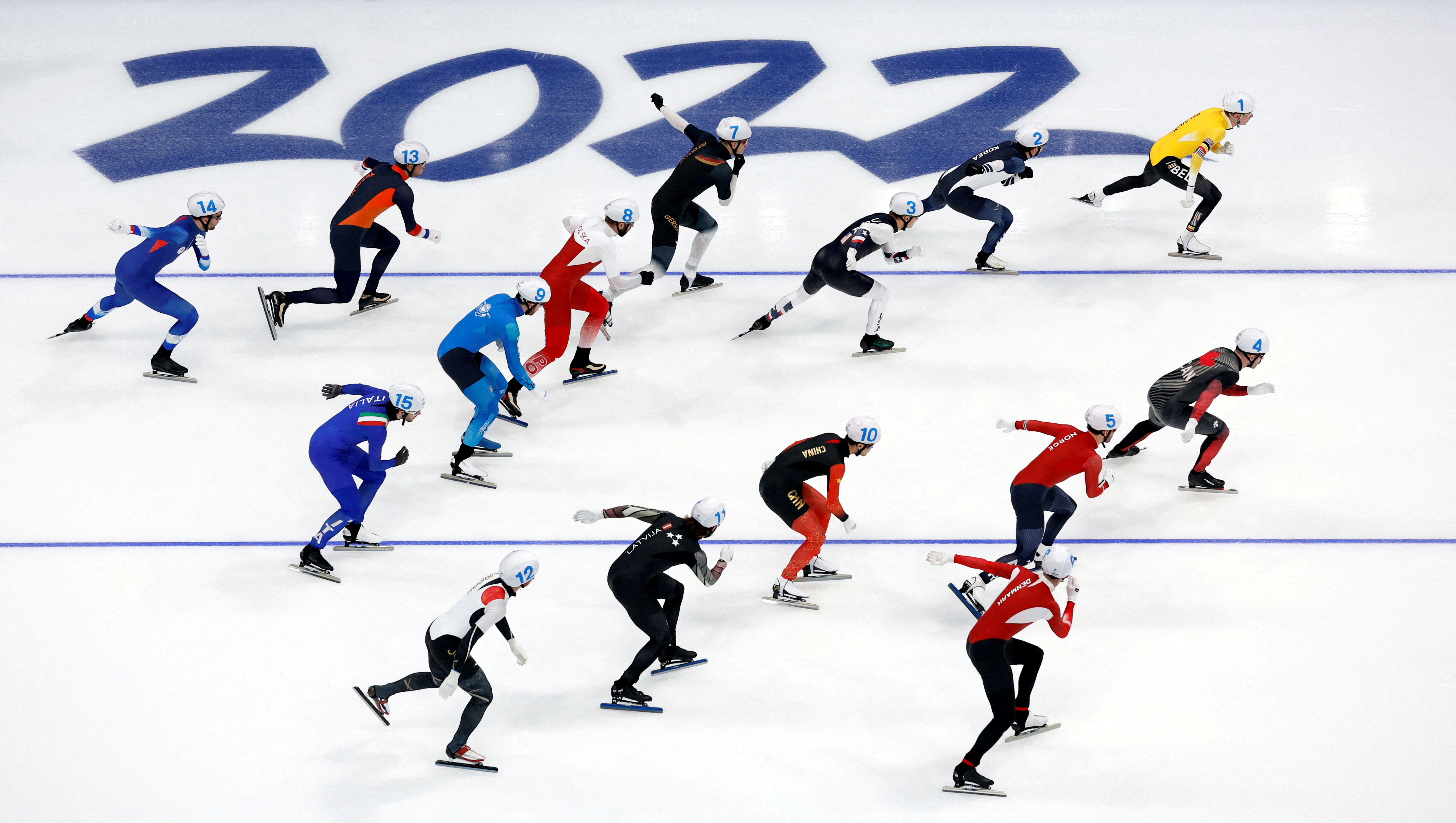 2022 Beijing Olympics - Speed Skating - Men's Mass Start Semifinals - National Speed Skating Oval, Beijing, China - February 19, 2022. Bart Swings of Belgium, Chung Jae Won of South Korea, Ian Quinn of the United States, Antoine Gelinas-Beaulieu of Canada, Kristian Ulekleiv of Norway, Stefan Due Schmidt of Denmark, Felix Rijhnen of Germany, Zbigniew Brodka of Poland, Dmitriy Morozov of Kazakhstan, Ning Zhongyan of China, Haralds Silovs of Latvia, Seitaro Ichinohe of Japan, Sven Kramer of the Netherlands, Daniil Aldoshkin of the Russian Olympic Committee and Michele Malfatti of Italy in action