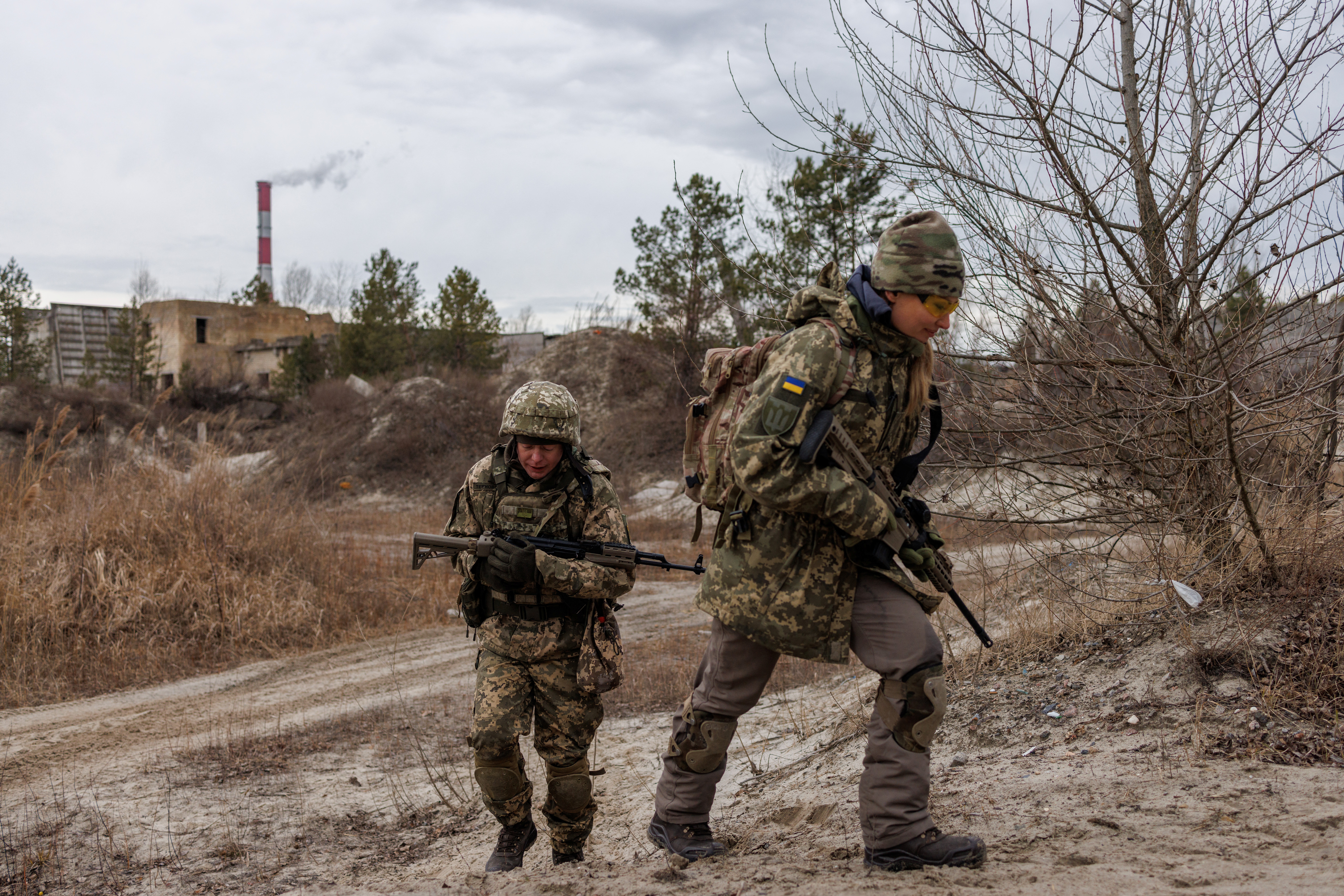 Alisa, 38, a media relations specialist, takes part in a combat skills training conducted by the Territorial Defense Forces, near Kyiv