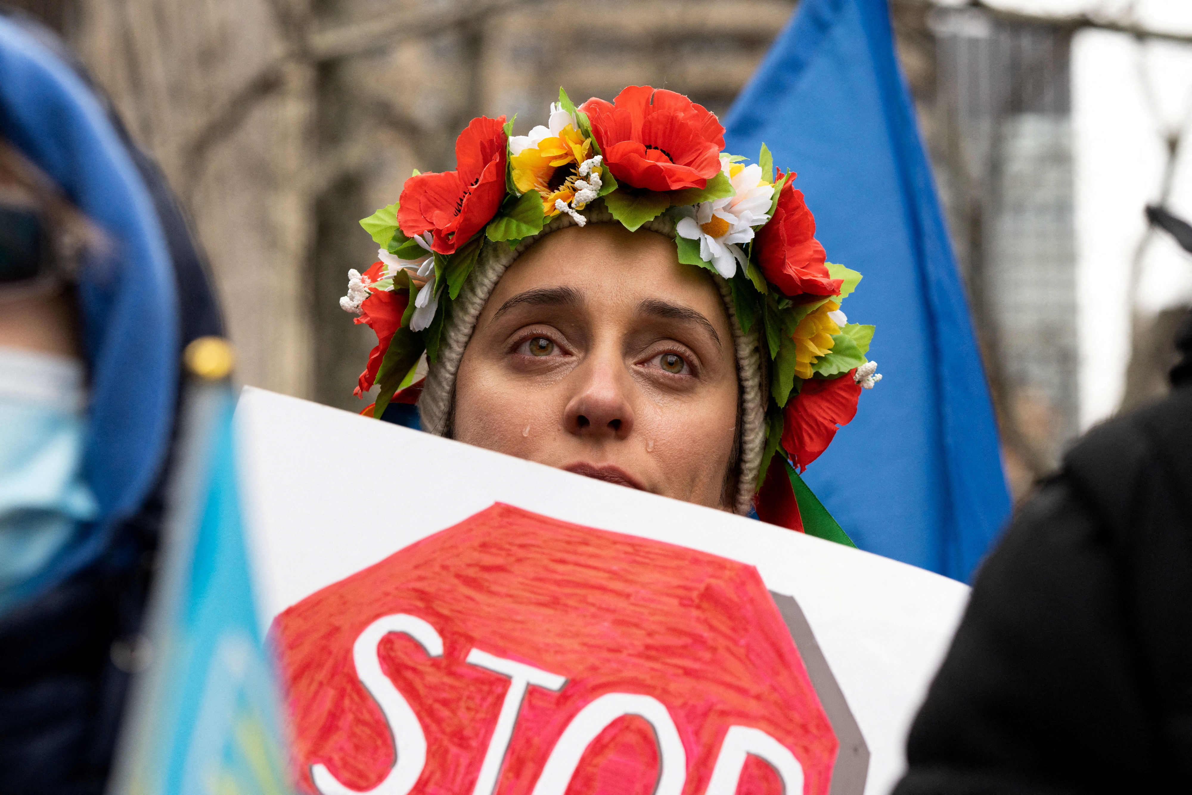 Protester carrying a story sign