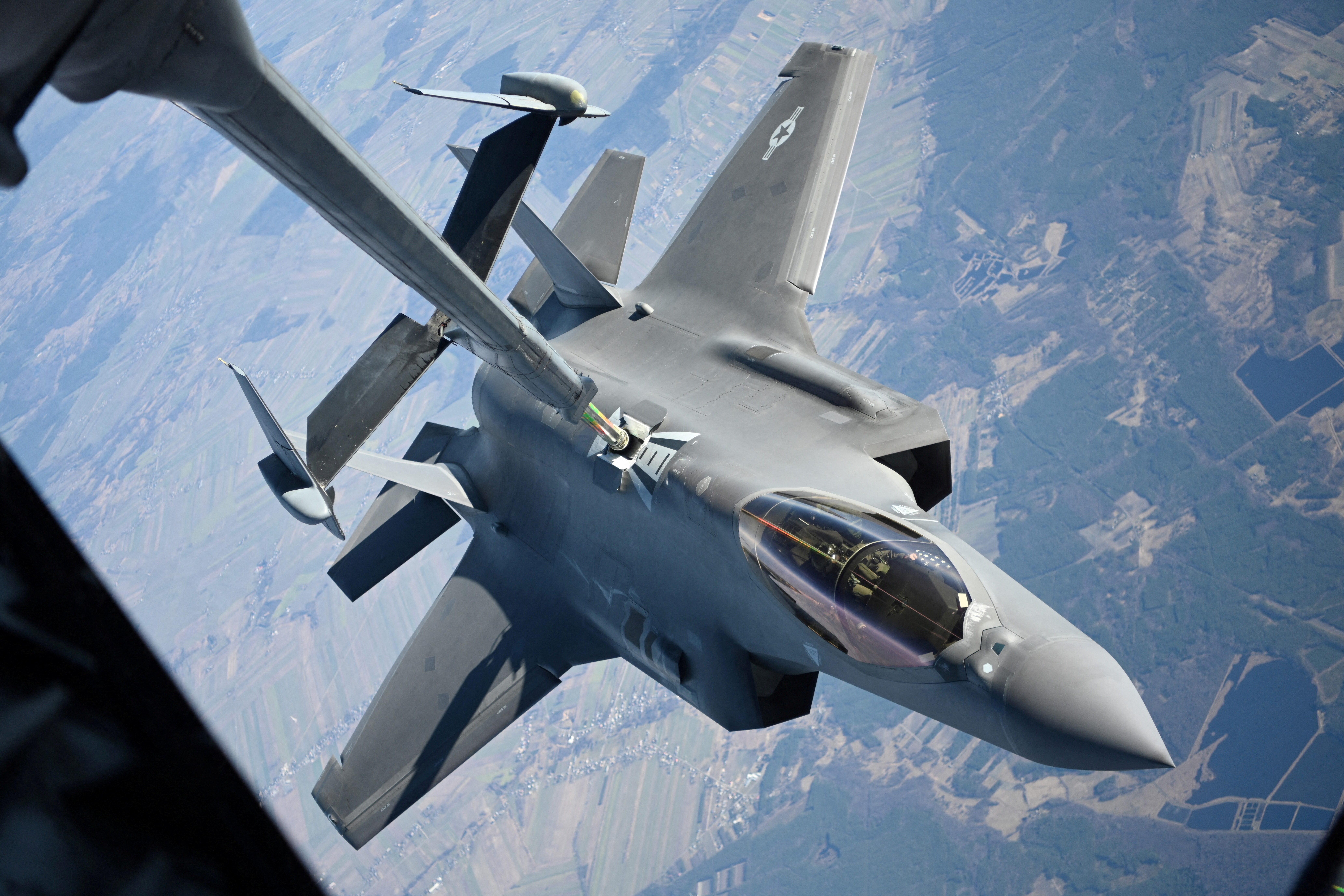 A U.S. Air Force F-35 Lightning II aircraft assigned to the 34th Fighter Squadron receives fuel from a KC-10 Extender aircraft over Poland, February 24, 2022.