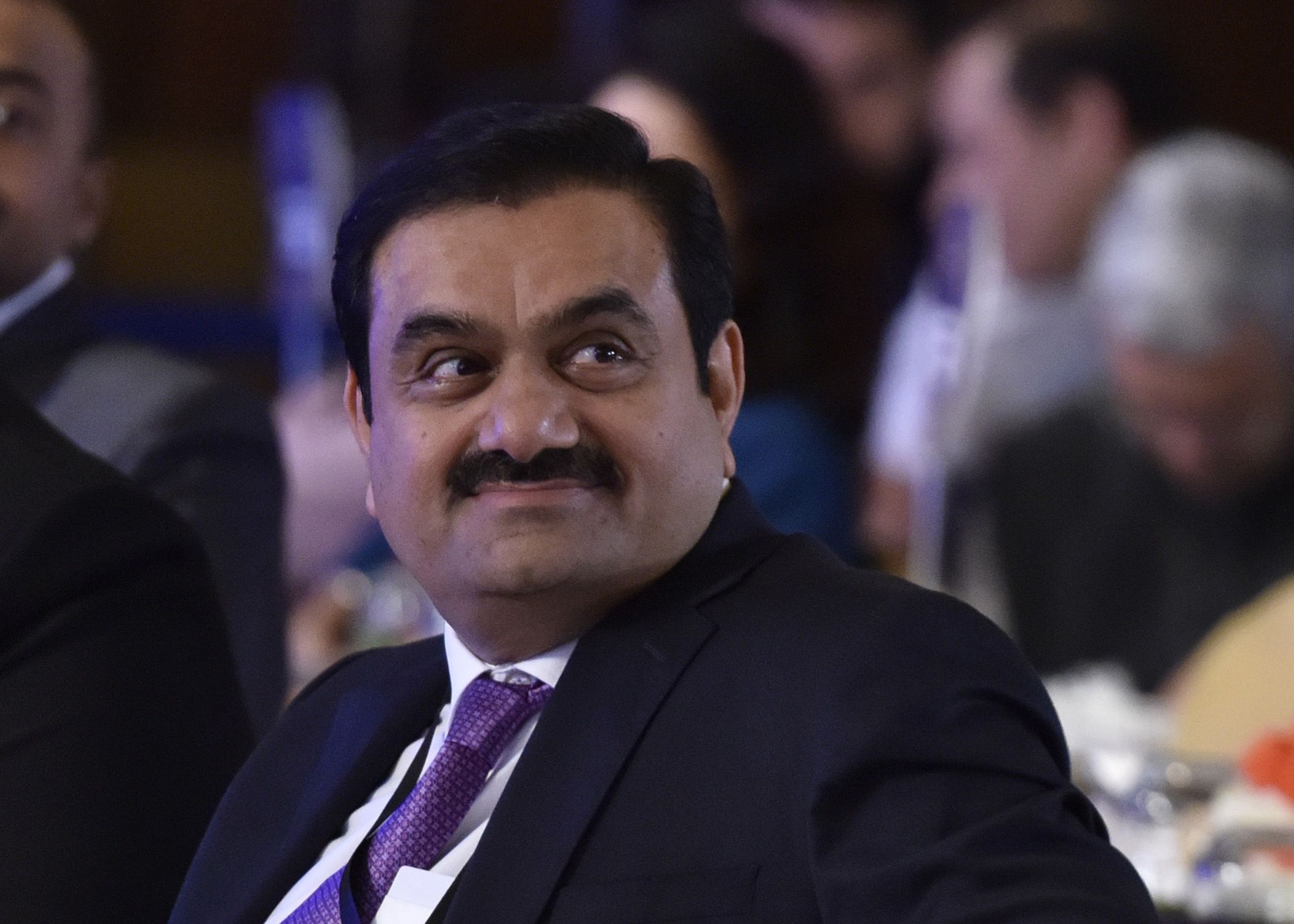 A smiling Gautam Adani in a suit