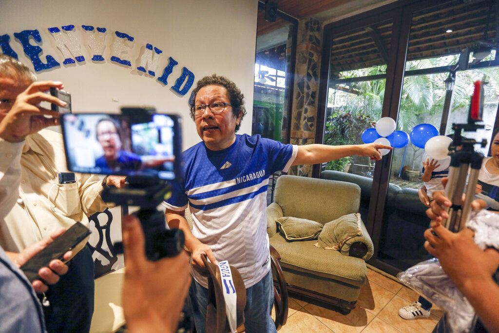 Nicaraguan journalist Miguel Mora speaks to the press after his release from prison, at his home in Managua, Nicaragua, in 2019.