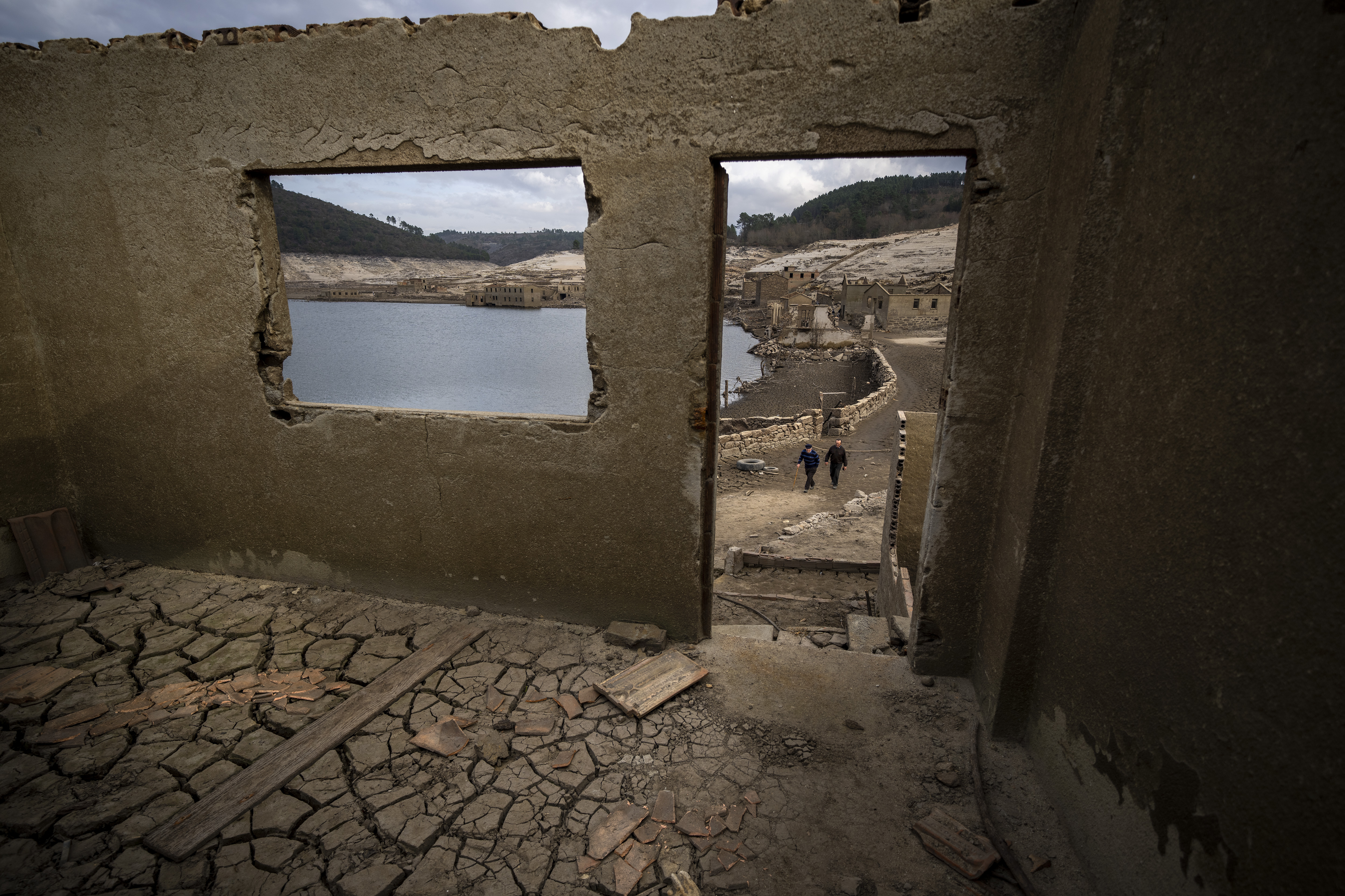 Jose Penin, 72, walks with his brother Julio, 78, as they visit the old village of Aceredo