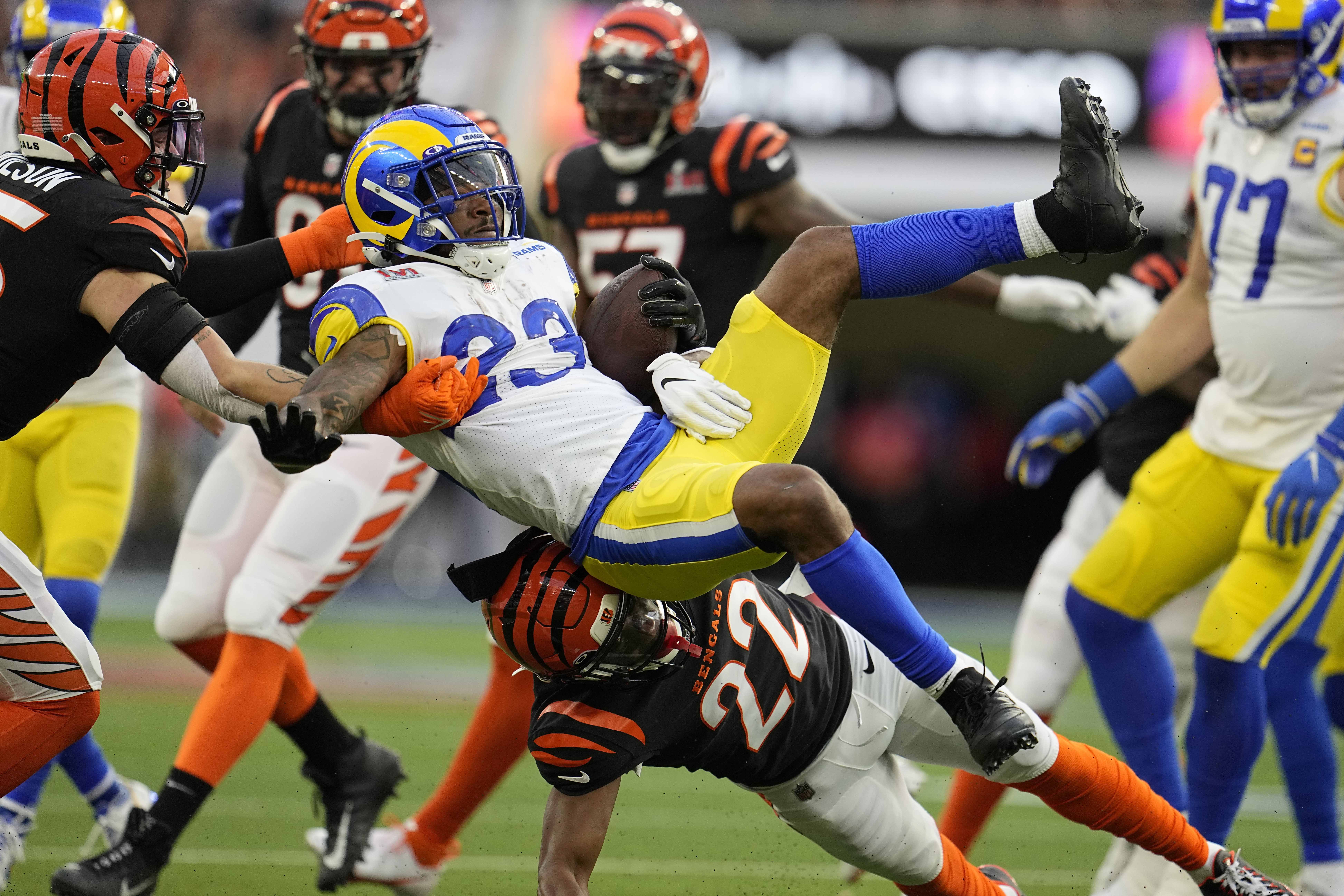Los Angeles Rams running back Cam Akers (23) is tackled by Cincinnati Bengals cornerback Chidobe Awuzie (22)