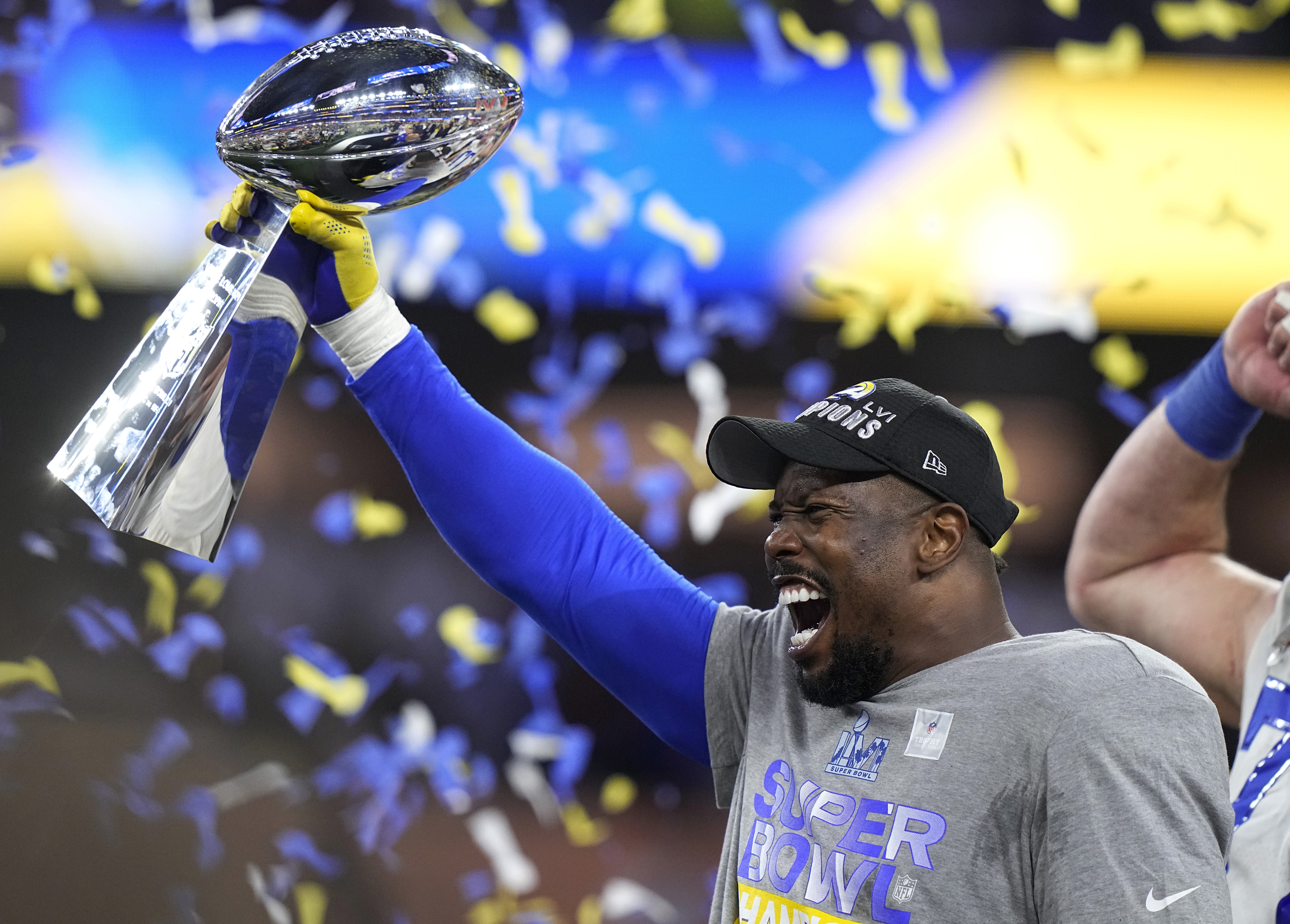 Los Angeles Rams outside linebacker Von Miller holds up the Lombardi Trophy