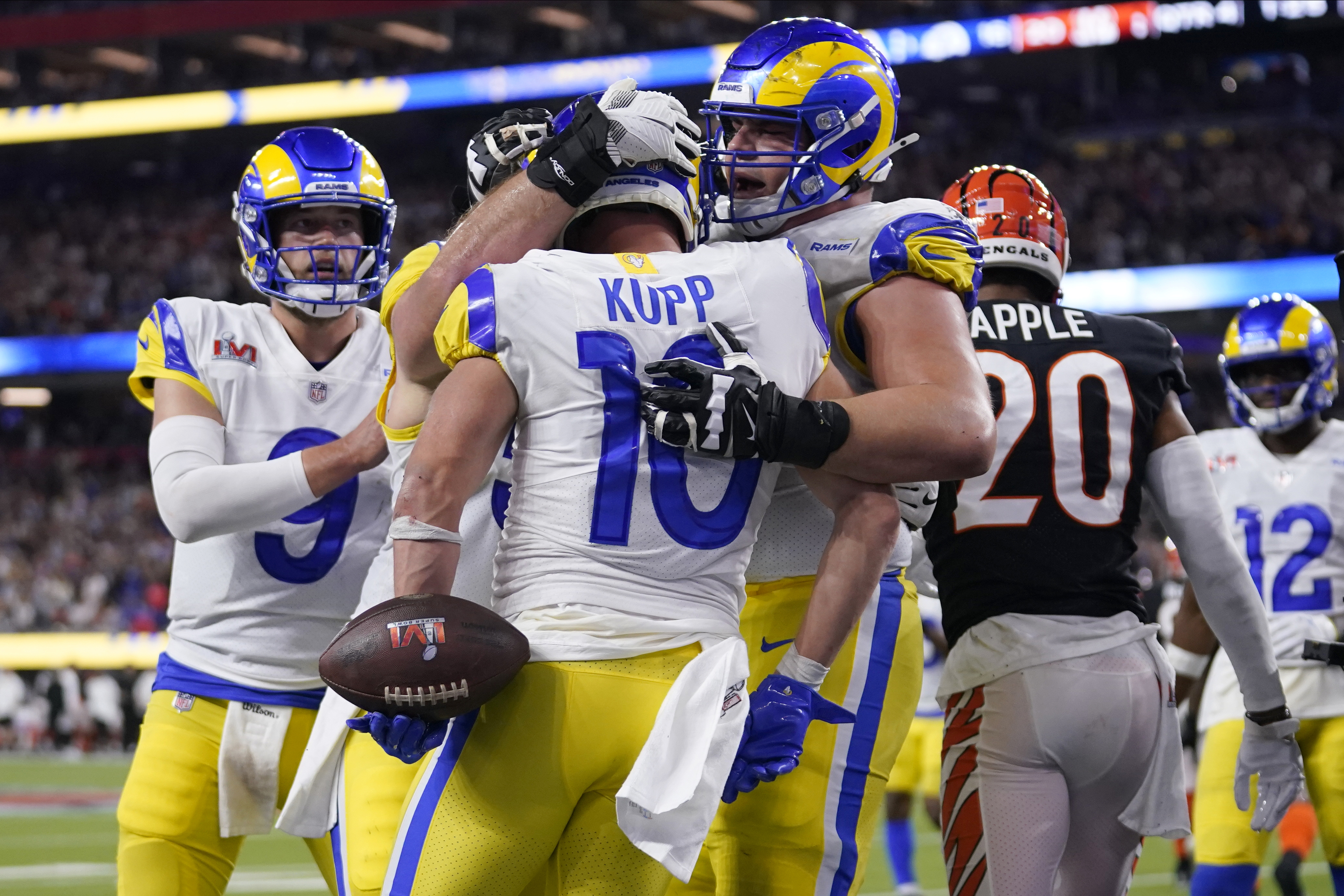 Los Angeles Rams wide receiver Cooper Kupp (10) is congratulated by teammates after scoring a touchdown