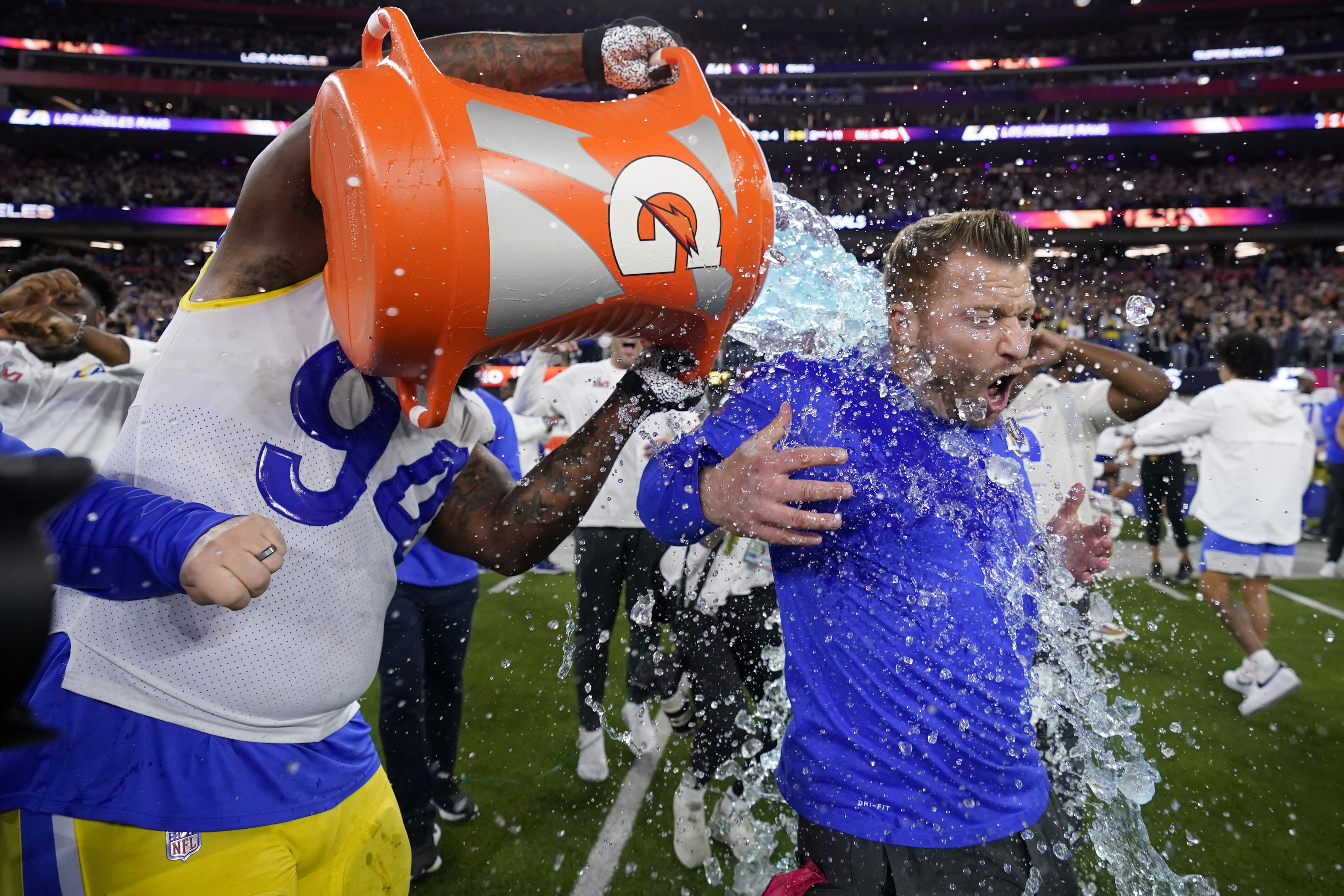 Los Angeles Rams defensive end A'Shawn Robinson, left, pours Gatorade over Los Angeles Rams head coach Sean McVay after the Rams defeated the Cincinnati Bengals