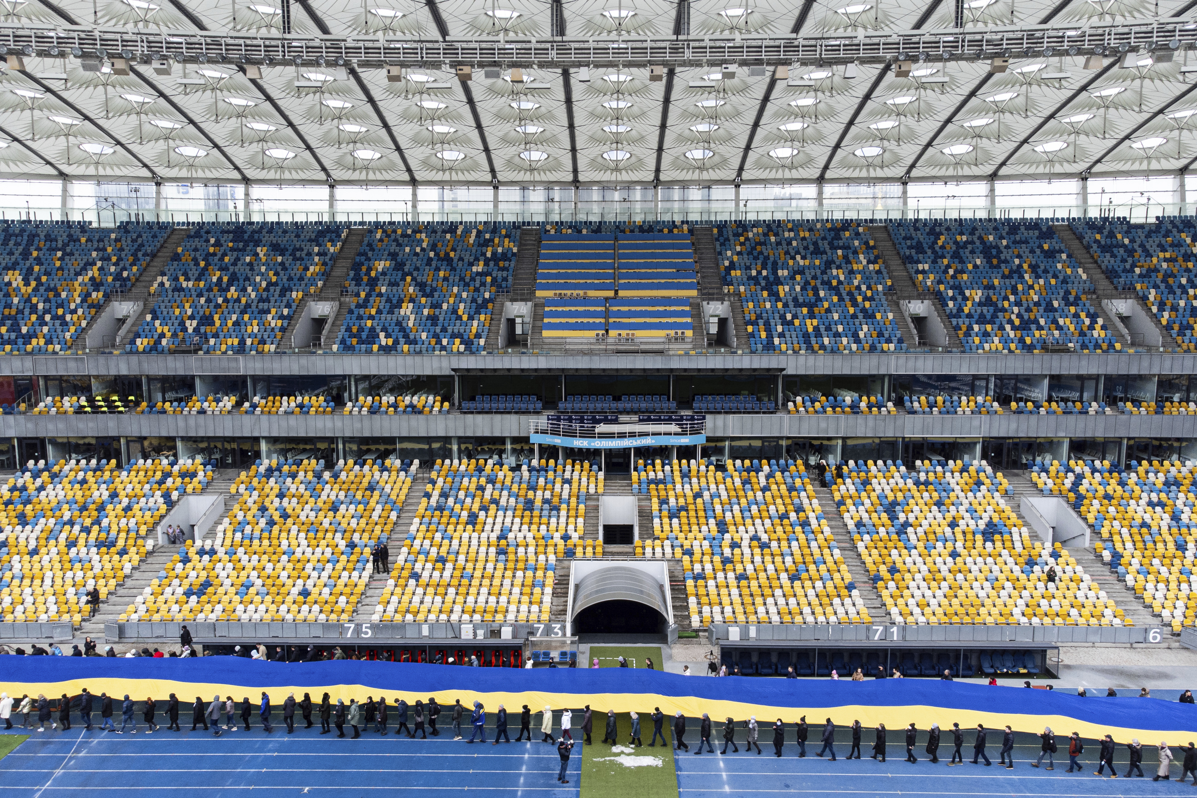 A 200 meter long Ukrainian flag is unfolded at the Olympiyskiy stadium in Kyiv,