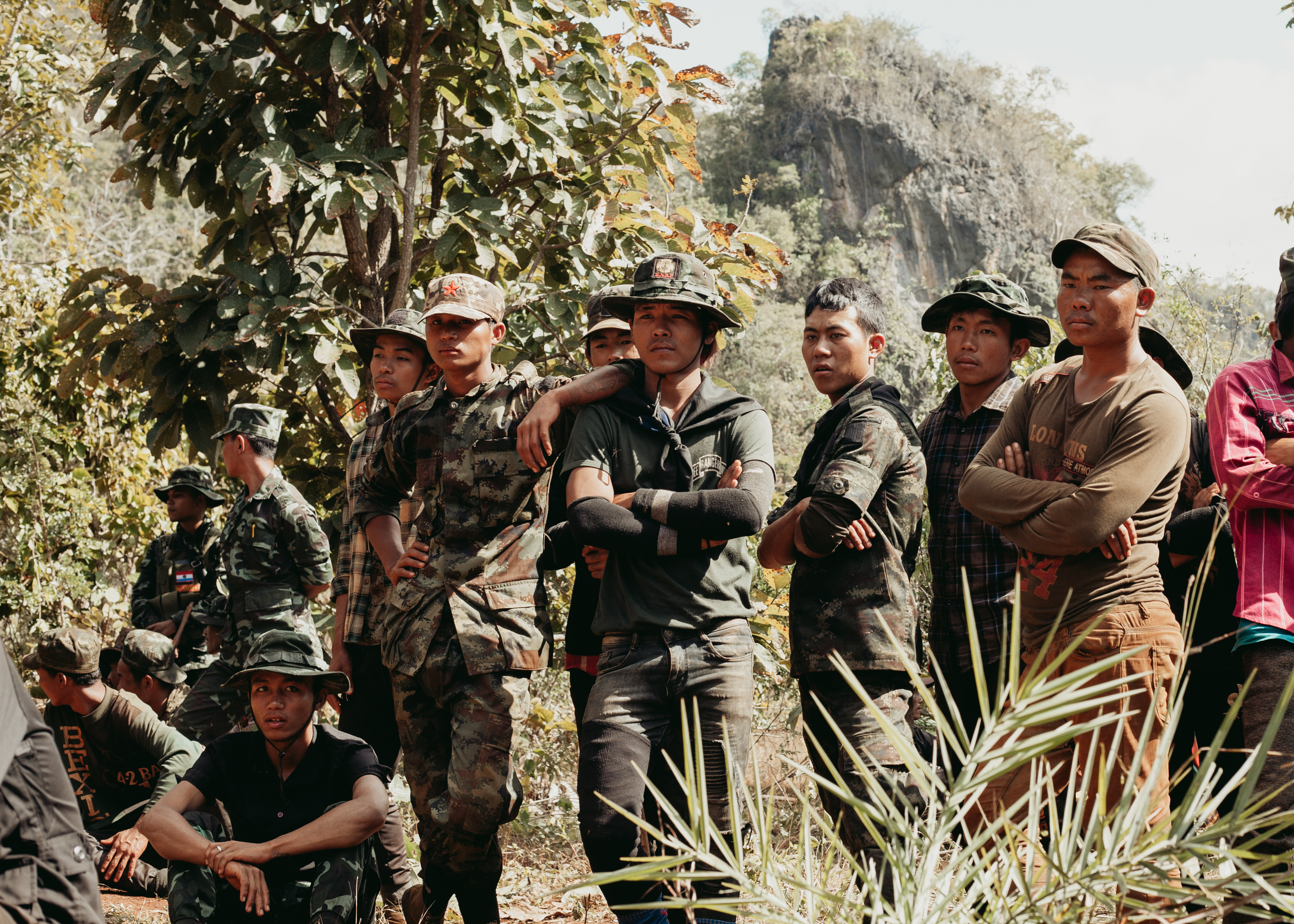 A group of cadets listen to instructions from one of the leading commanders at their base.
