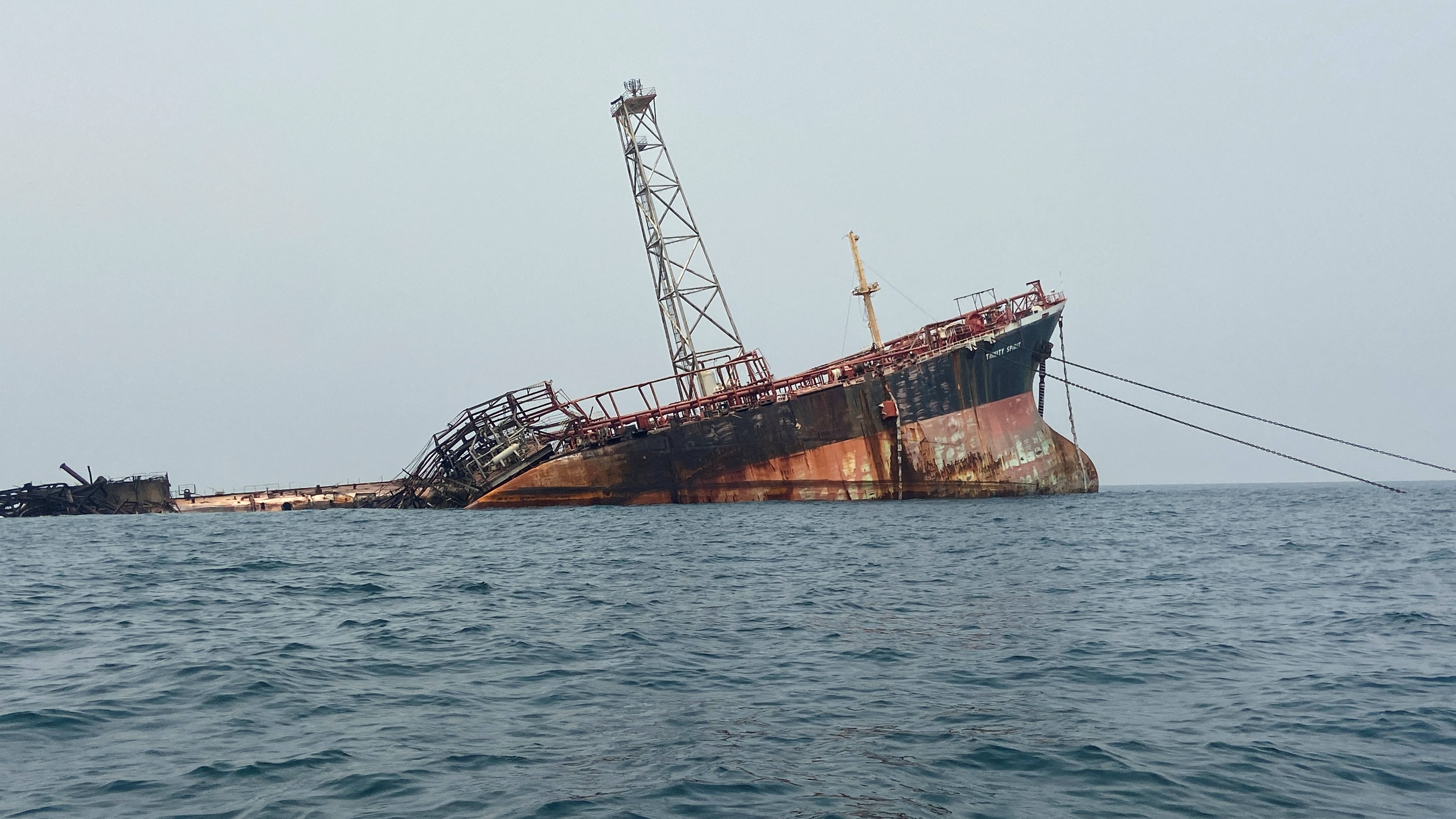 Wreckage of the Trinity Spirit floating production, storage and offloading vessel is seen after an explosion and fire broke out at Shebah Exploration & Production Company Ltd offshore production site