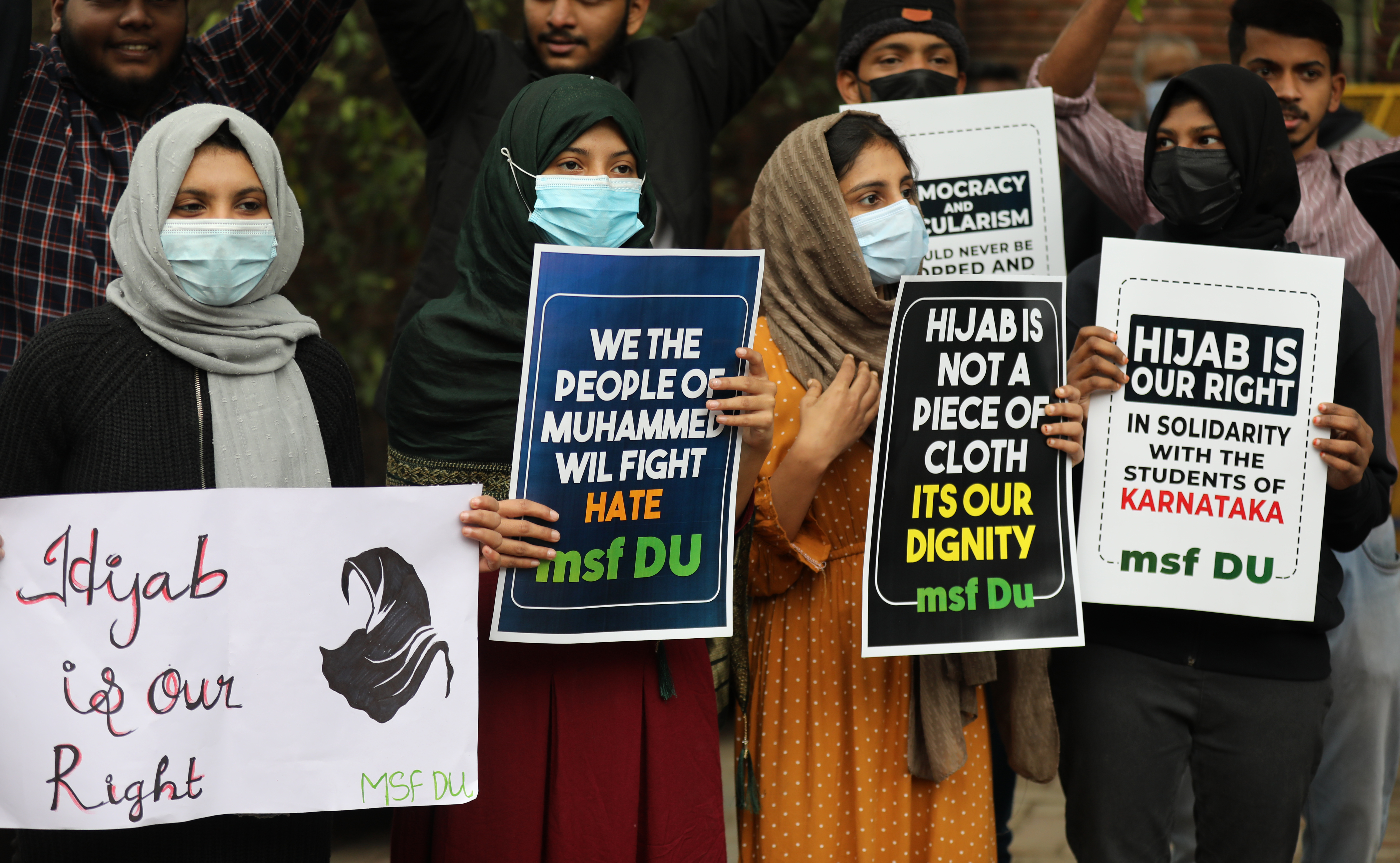 Indian student activists from Muslim Students Federation (MSF) hold placards during a protest against hijab restriction, in New Delhi