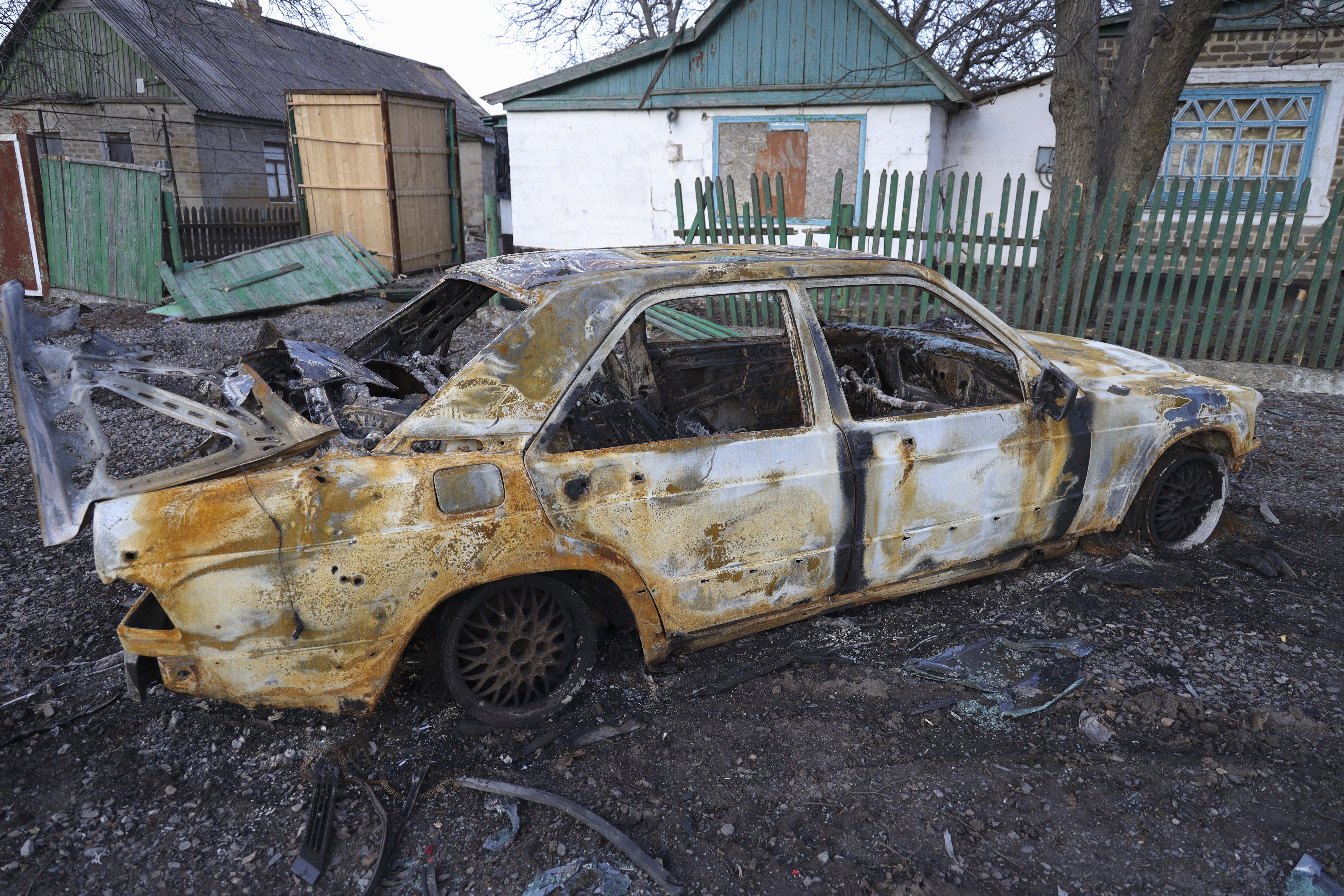 A damaged car in Tamarchuk village near Marinka not far from pro-Russian-fighters controlled city of Donetsk, Ukraine