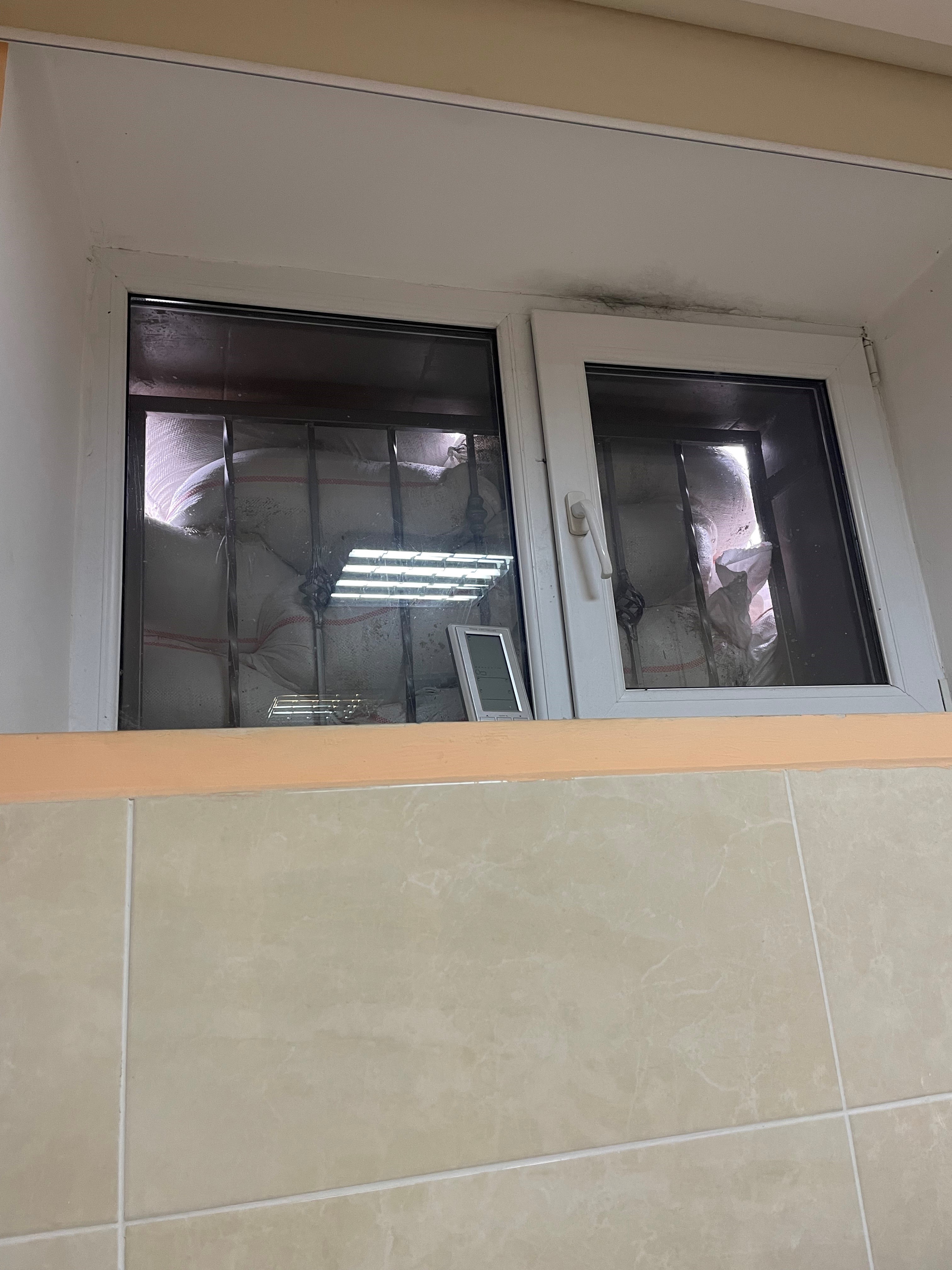 Sandbags behind windows in the hospital basement 