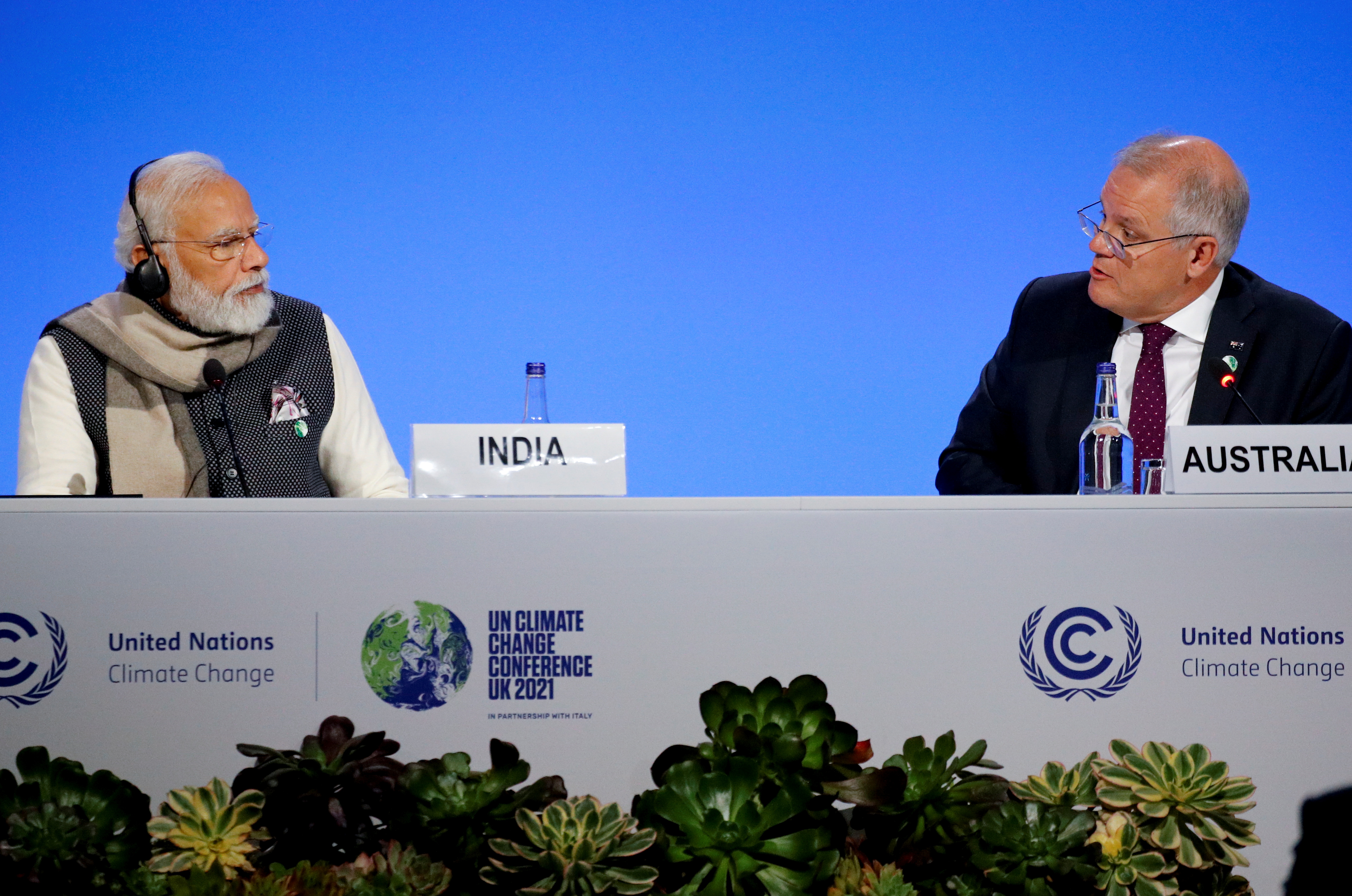 India's Prime Minister Narendra Modi, and Australia's Prime Minister Scott Morrison attend a meeting