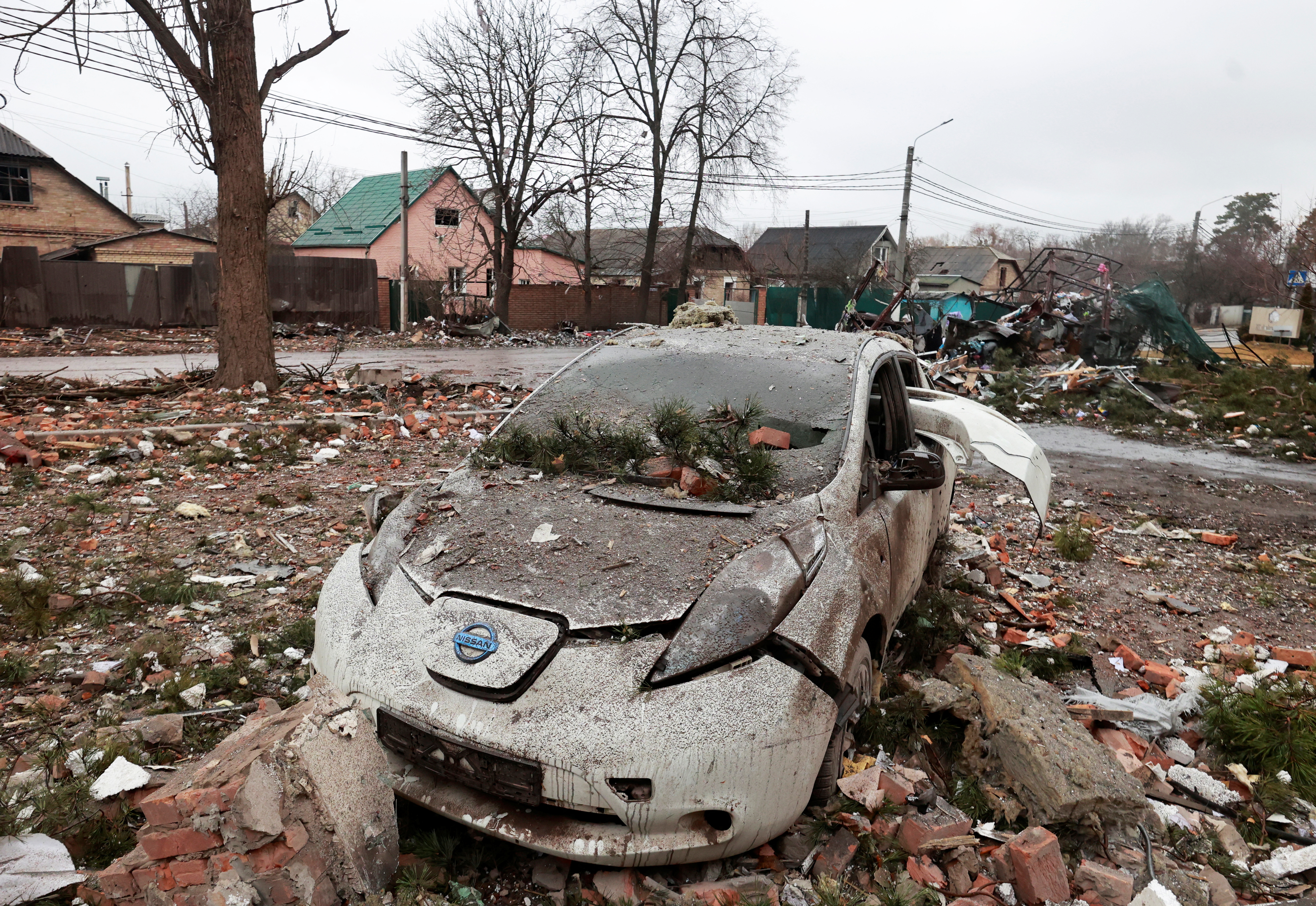 A destroyed car is seen in Irpin, Ukraine