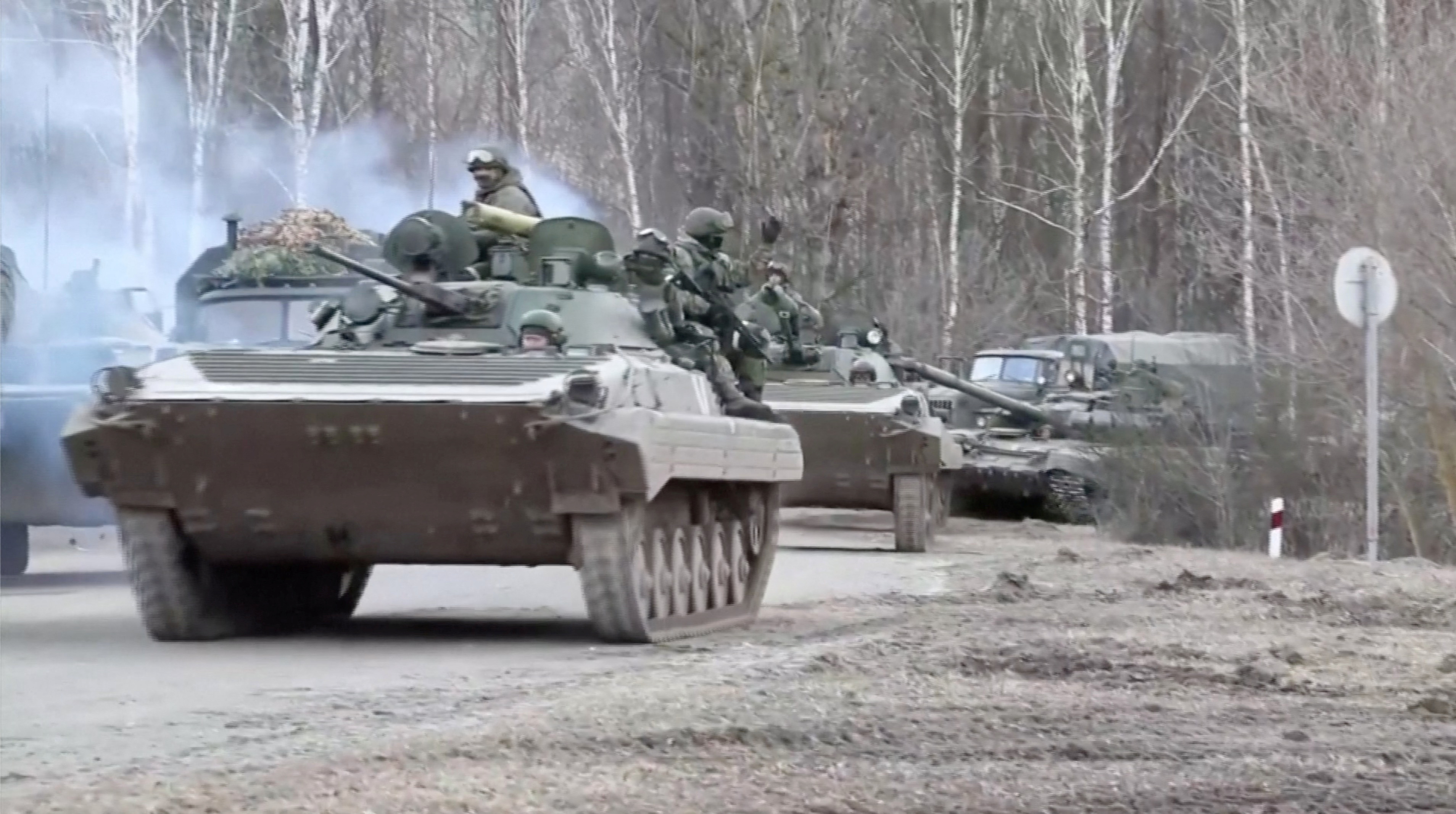 Russian tanks move along a road near Kyiv