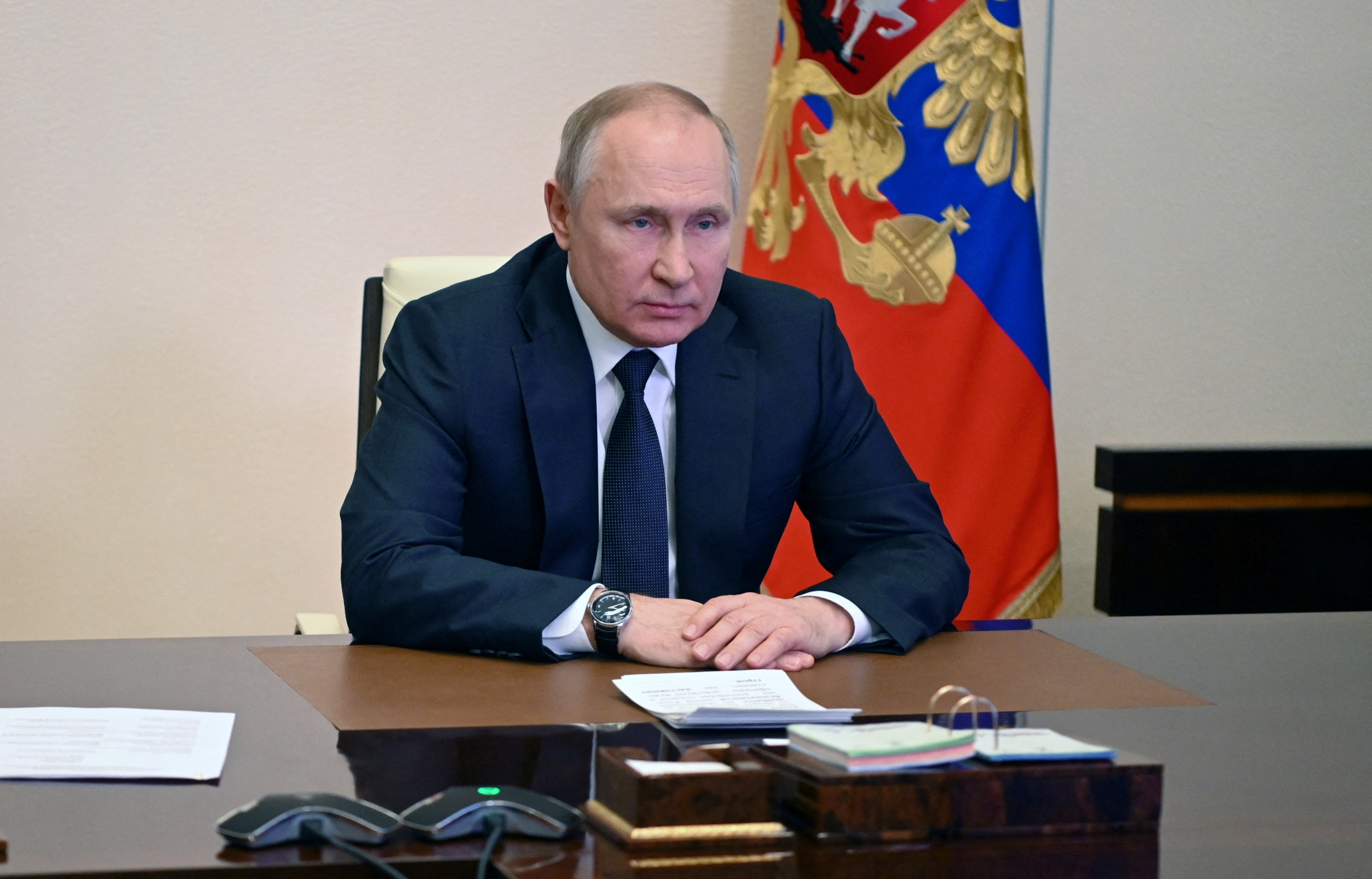 Russian President Vladimir Putin chairs a meeting with members of the Security Council via a video link at the Novo-Ogaryovo state residence outside Moscow