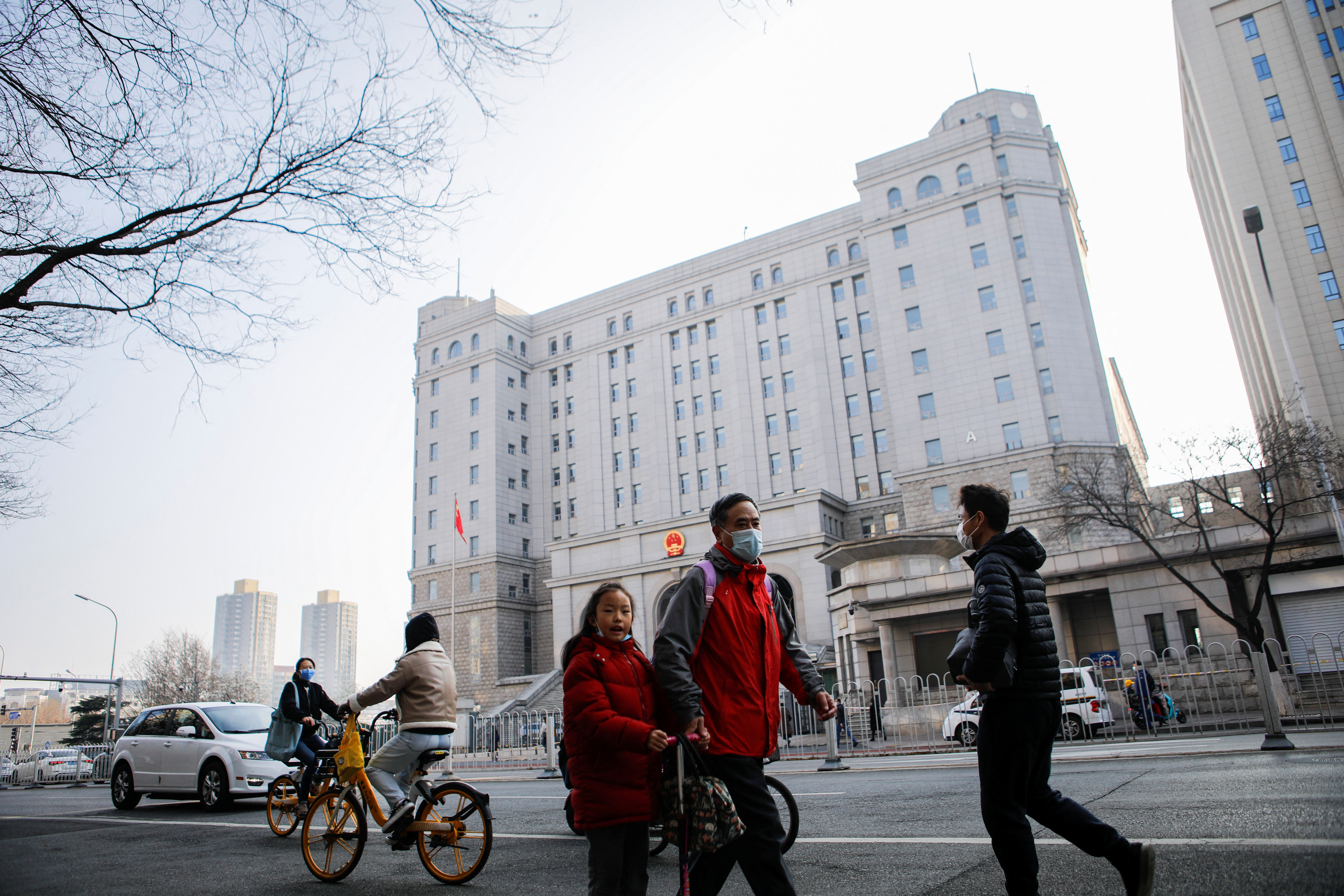 People walk outside the imposing building of the No 2 Intermediate People's Court in Beijing