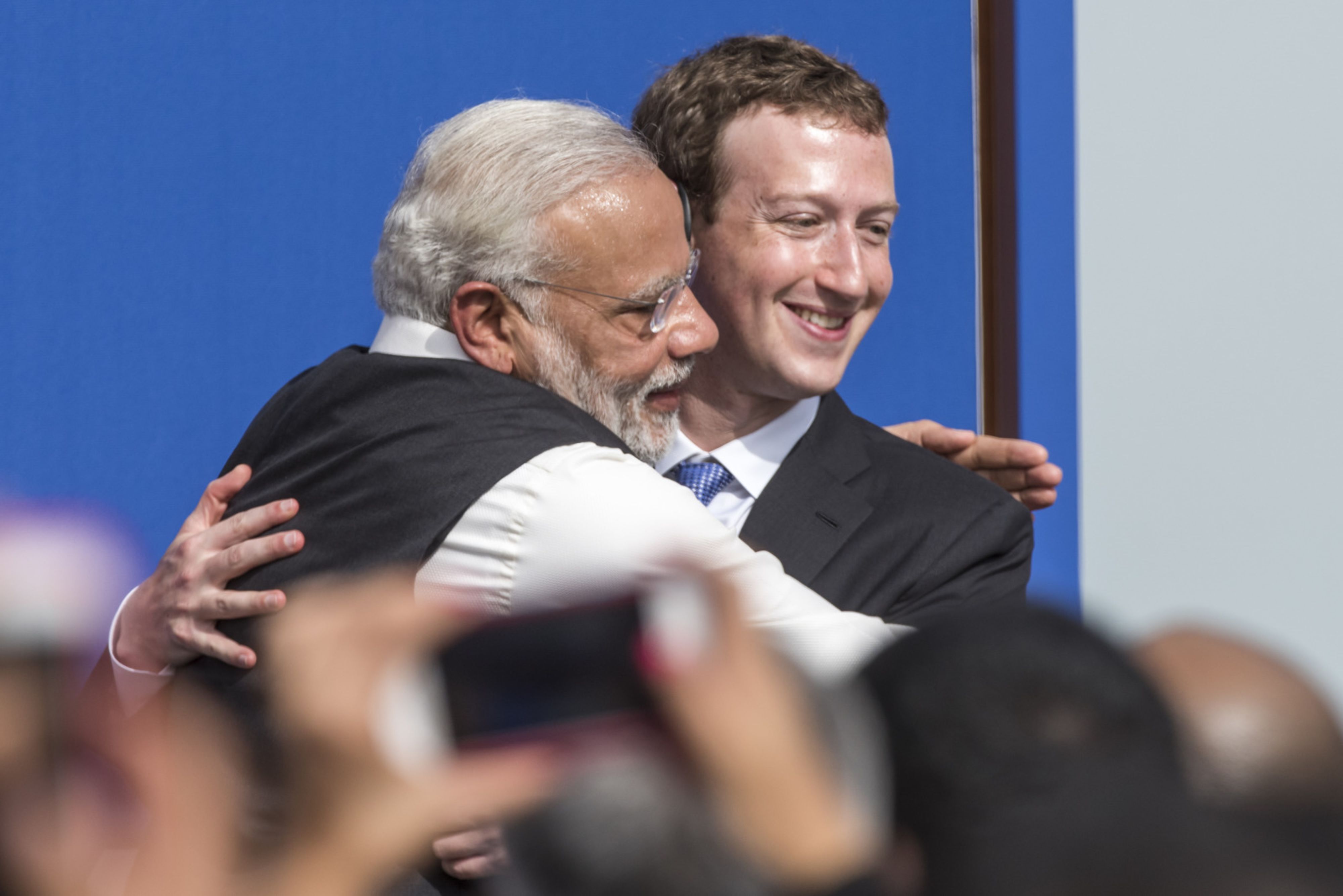Narendra Modi, India's prime minister, hugs Facebook CEO Mark Zuckerberg