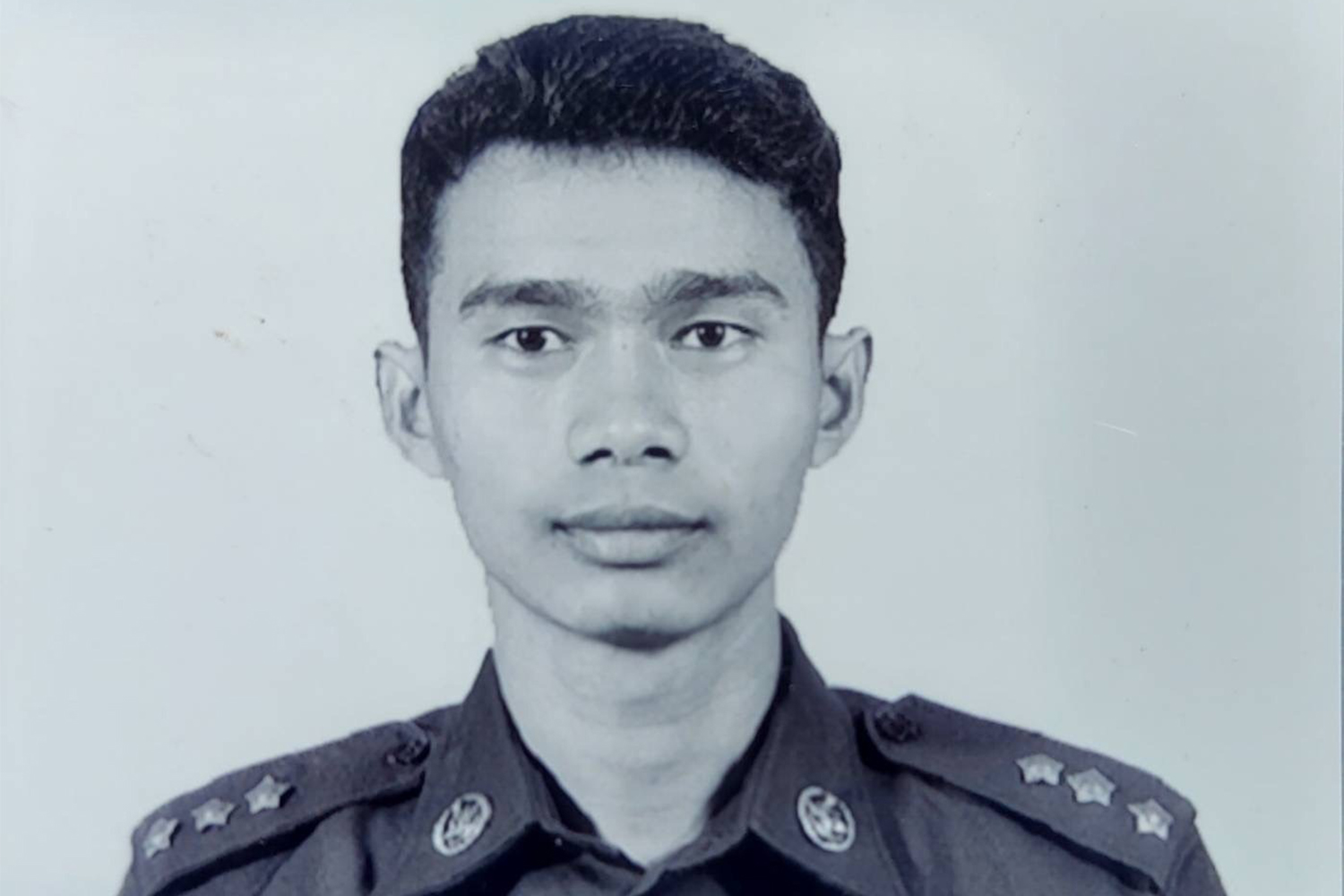 Photo of Nyi Thuta in military fatigues