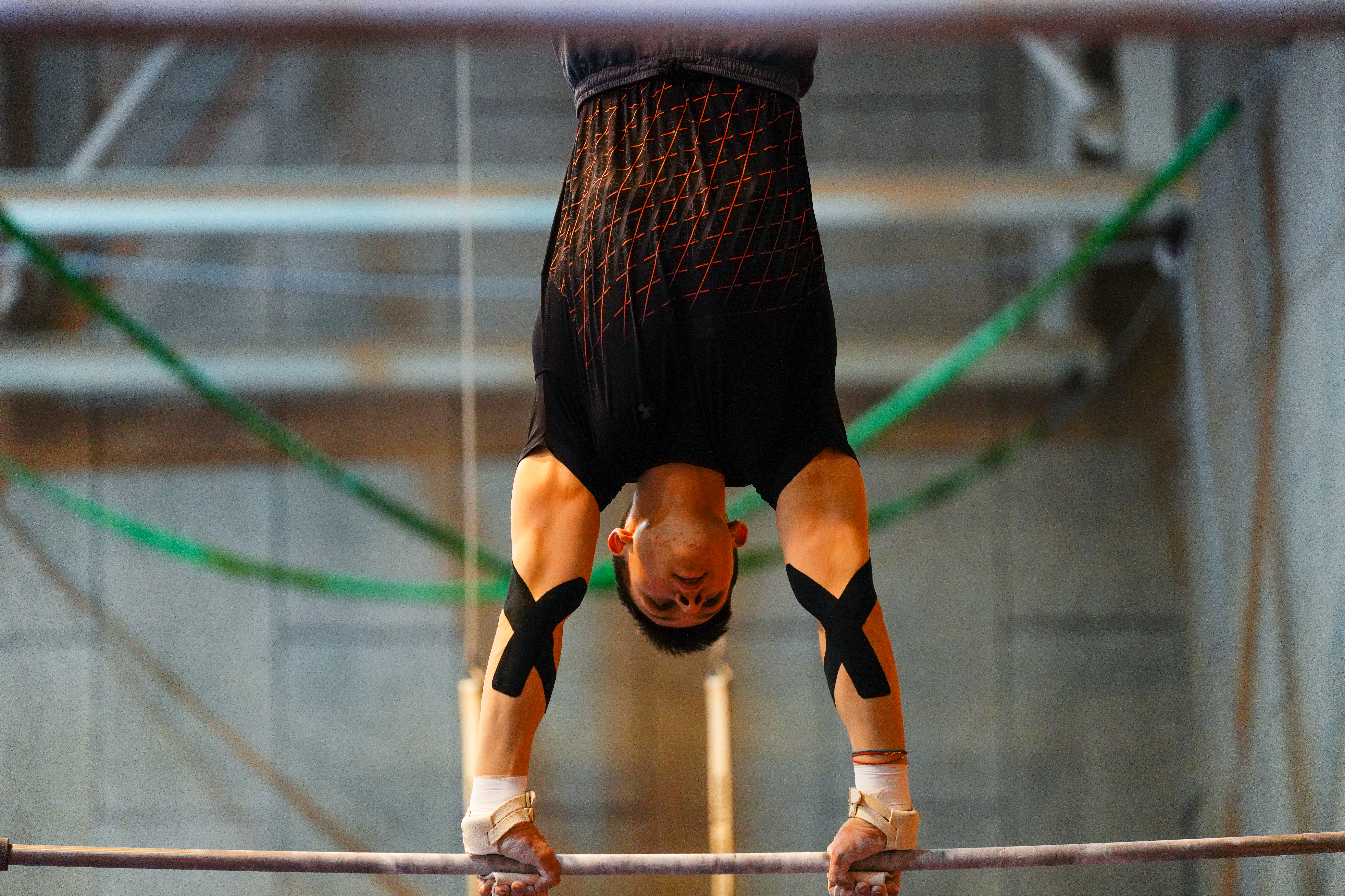 athlete Ilia Kovtan practised on the horizontal bar