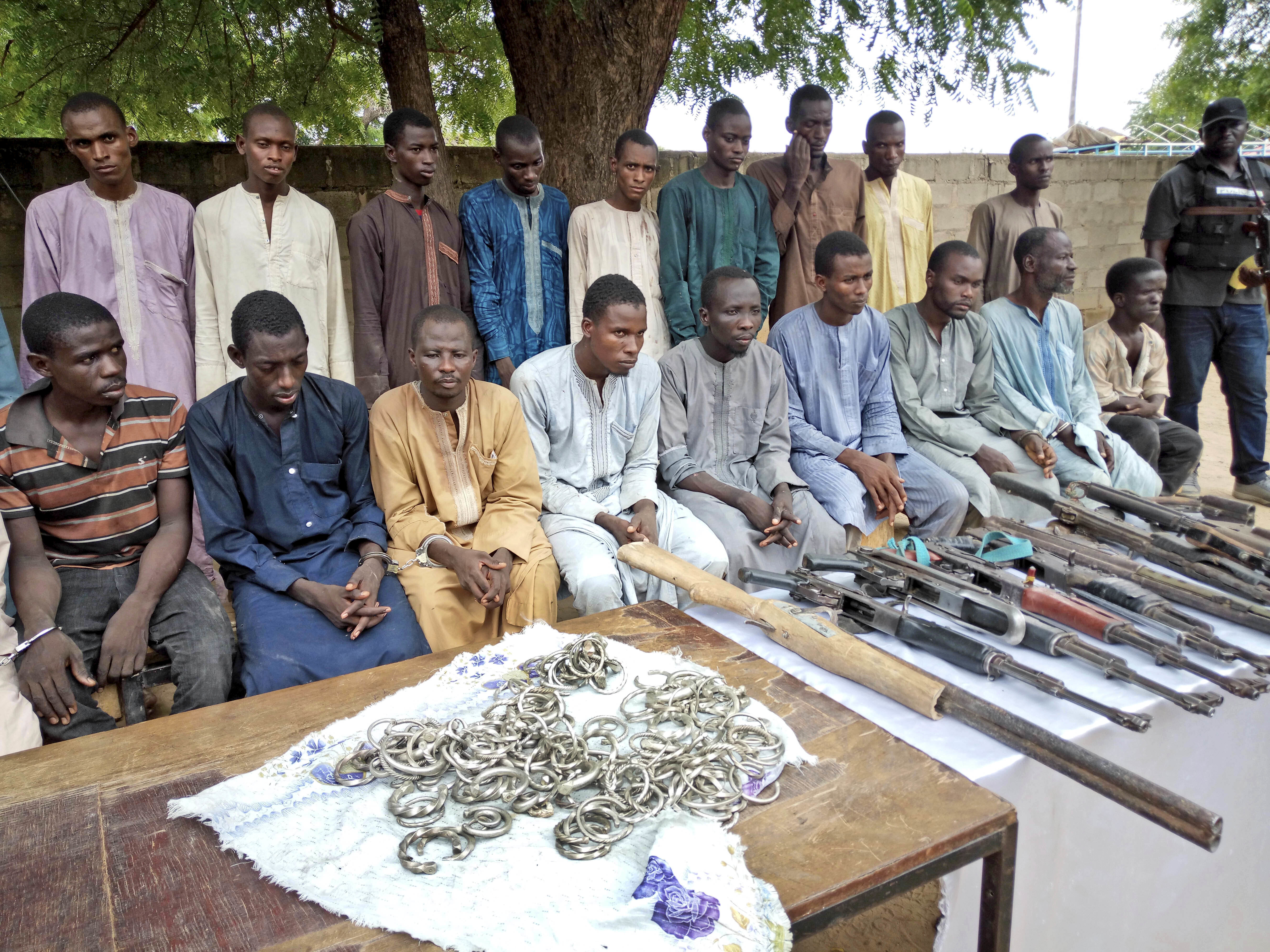 A group of men identified by Nigerian police as Boko Haram extremist fighters and leaders are shown to the media