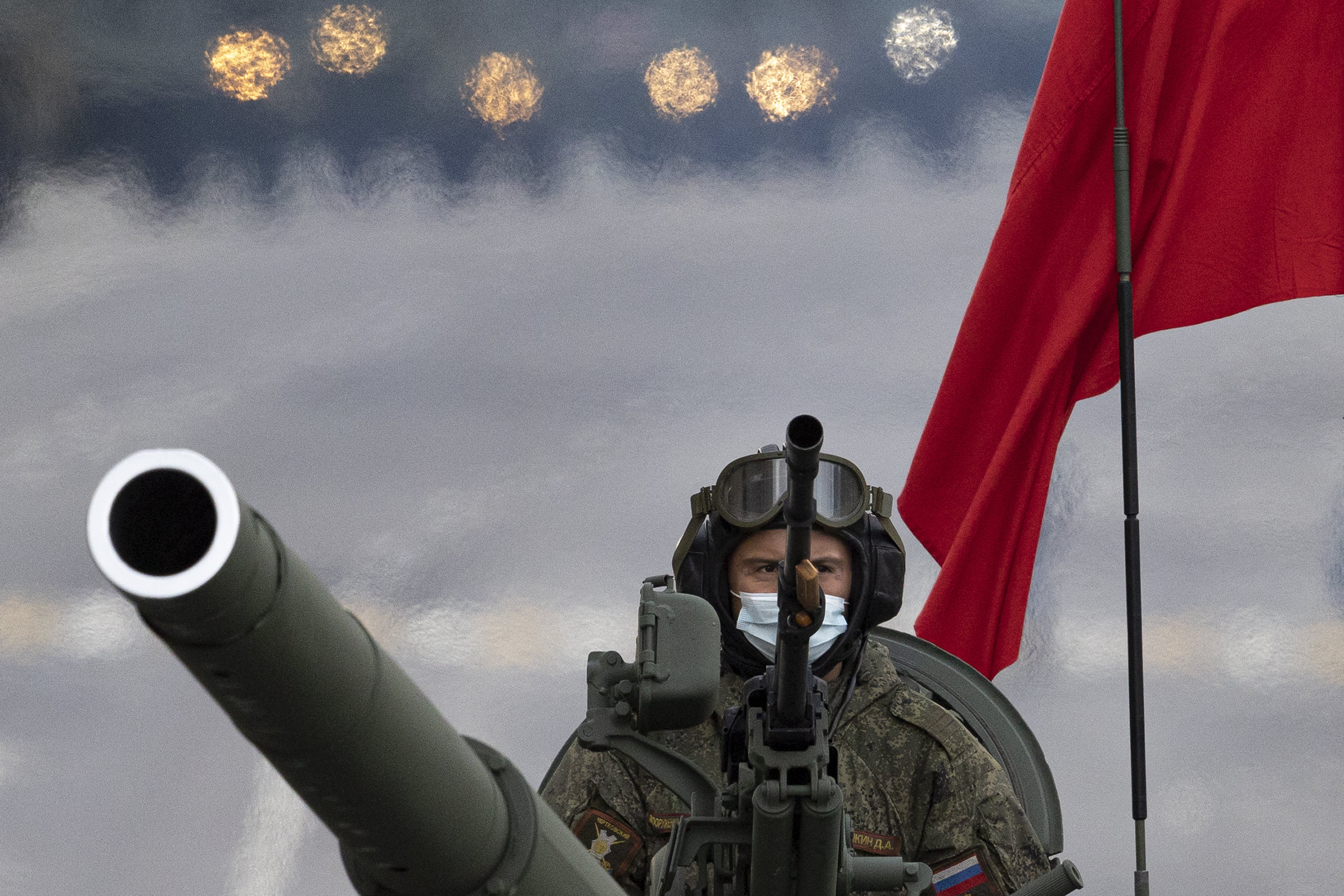 A photo of a Russian soldier holding a gun.