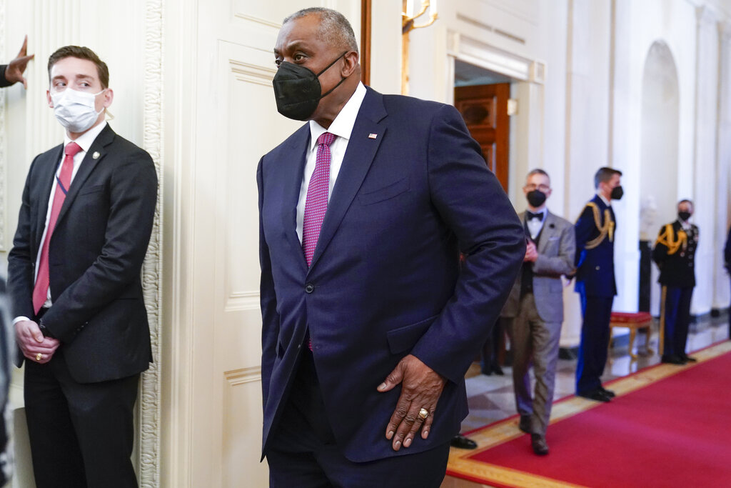 Defense Secretary Lloyd Austin arrives before President Joe Biden speaks at an event to celebrate Black History Month in the East Room of the White House.