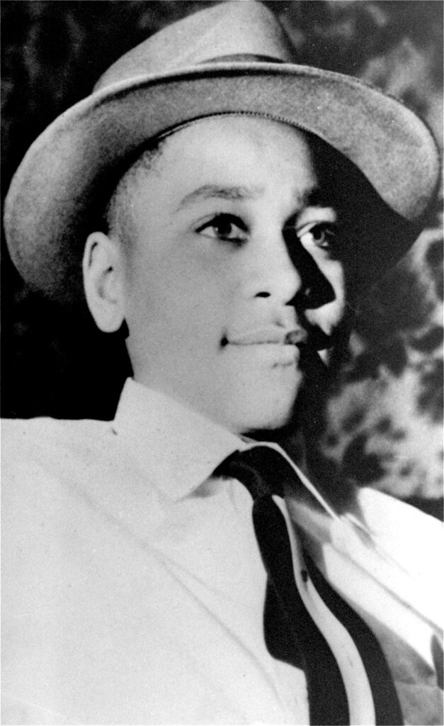 An undated portrait photo shows Emmett Till