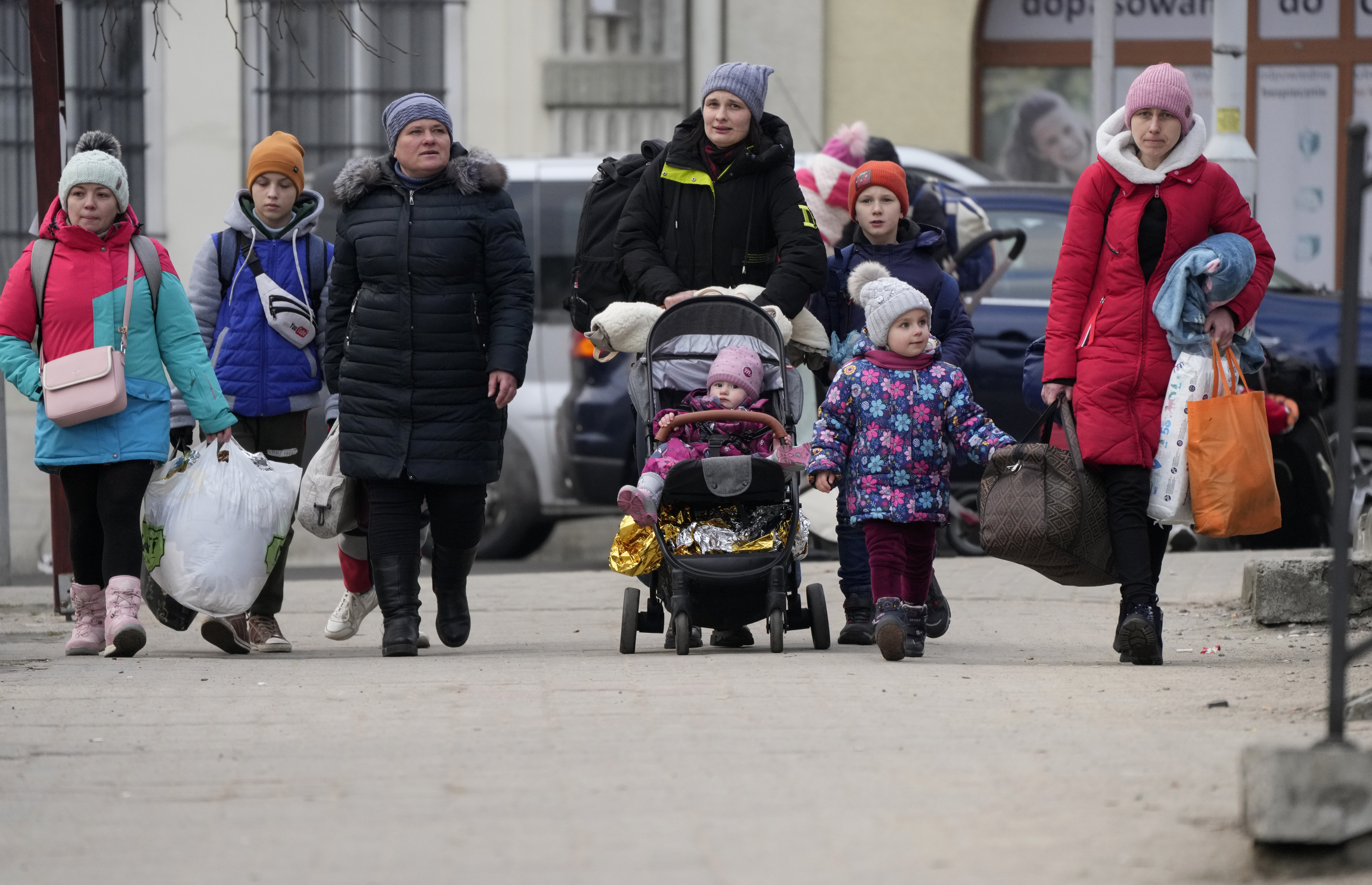 Women and children, fleeing from Ukraine, arrive on the platform of the train station in Przemysl,
