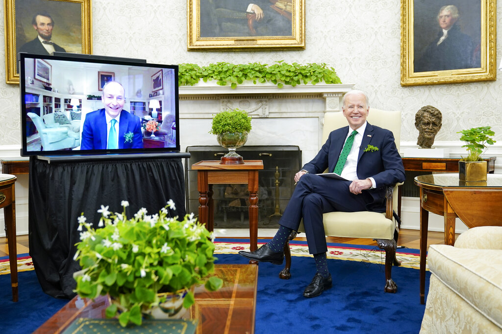 President Joe Biden and Irish Prime Minister Micheál Martin meeting virtually in the Oval Office smiled for the cameras. Martin tested positive for COVID-19 Wednesday.