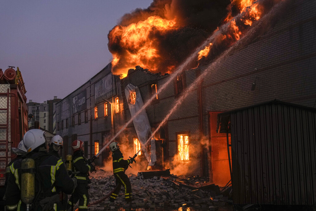 Ukrainian firefighters extinguish a blaze